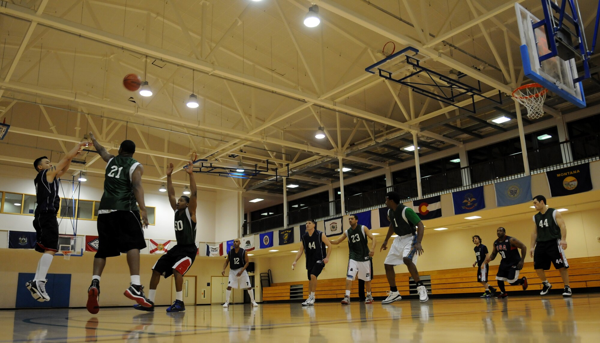 RAF MILDENHALL, England – Johnny Inlavong, 488th Intelligence Squadron, spots up a three-point attempt over Daniel Porter during the Intramural Basketball Championship game at the Hardstand Gym Feb. 18. IS wasn’t able to pull out the victory, dropping two games in a row and losing to the 100th Maintenance Group 63-55 and 61-41, making the MXG RAF Mildenhall’s 2010 Intramural Basketball Champions. (U.S. Air Force photo/ Staff Sgt. Jerry Fleshman)