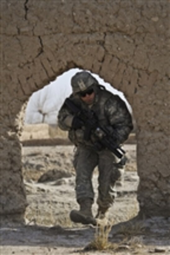 U.S. Army Pfc. Jonathan Gentry, from Alpha Company, 1st Battalion, 17th Infantry Regiment, provides security during a dismounted patrol in support of Operation Helmand Spider in Badula Qulp, Helmand province, Afghanistan, on Feb. 15, 2010.  