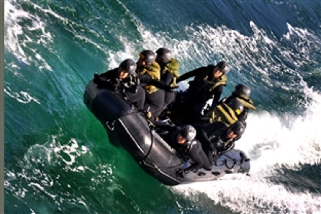 Soldiers from the Japanese Ground Self-Defense Force prepare to land a combat rubber reconnaissance craft in the well deck of the amphibious transport dock ship USS New Orleans during Operation Iron Fist off the coast of San Diego, Feb. 13, 2010. 
