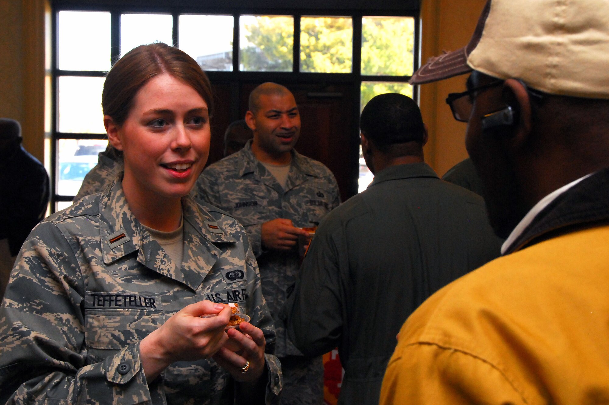First Lt. Julie Teffeteller talks with Vincent Sturdivant while testing a parfait desert alternative during the Second Annual Force Support Squadron Food Show at the Charleston Club here Feb. 18. The purpose of the event was to see what tastes Team Charleston enjoyed most, providing base dining services with feedback on how to increase menu variety. Lieutenant Teffeteller is the 628th Force Support Squadron food service officer, and Mr. Sturdivant is a military sales broker with World Marketing. (U.S. Air Force photo/Staff Sgt. Daniel Bowles)