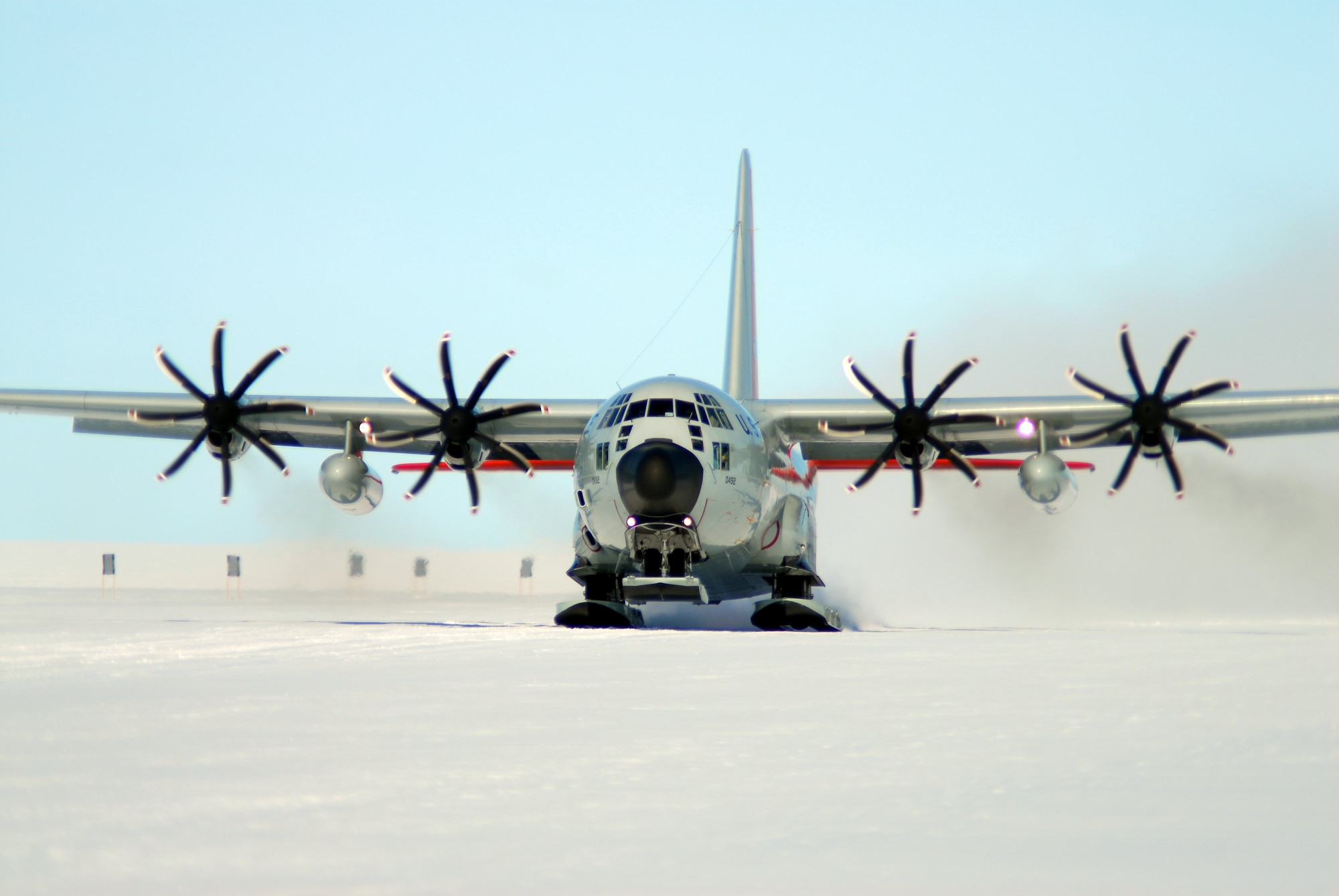 An LC-130 Hercules fitted with new eight-bladed propellers takes off in Antarctica as part of Operation Deep Freeze, the Department of Defense's logistical support to the National Science Foundation and U.S. Antarctic Program.  The propellers permit more cargo and passengers to be hauled using fewer missions and less fuel.  Joint Task Force Support Forces Antarctica, led by 13th Air Force at Joint Base Pearl Harbor Hickam, Hawaii, wrapped up the most recent ODF season Feb. 24.  (Courtesy photo)