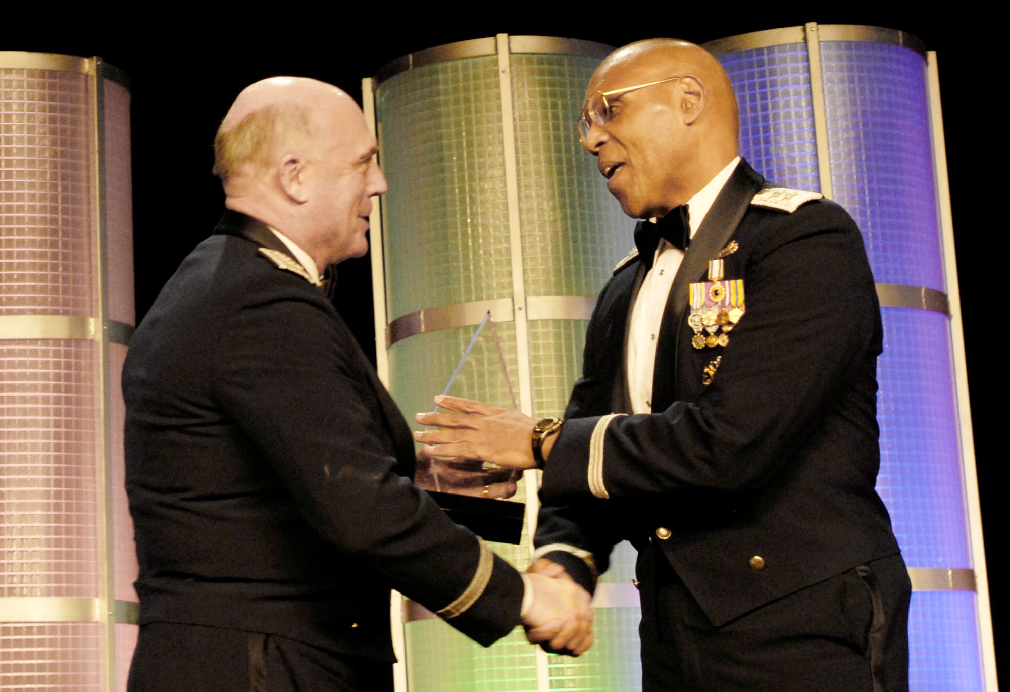 Air Force Vice Chief of Staff Gen. Carrol H "Howie" Chandler (left) presents the Career Achievement in Government award to Maj. Gen. Larry Spencer Feb. 20, 2010, at the Black Engineer of the Year Awards conference in Baltimore.  The BEYA conference awards recognize those with exceptional career gains in various vocations in science, technology, engineering and mathematics career fields.  General Spencer was recently confirmed for promotion as well as a position on the Joint Staff.  (U.S. Air Force photo/Staff Sgt. J.G. Buzanowski)