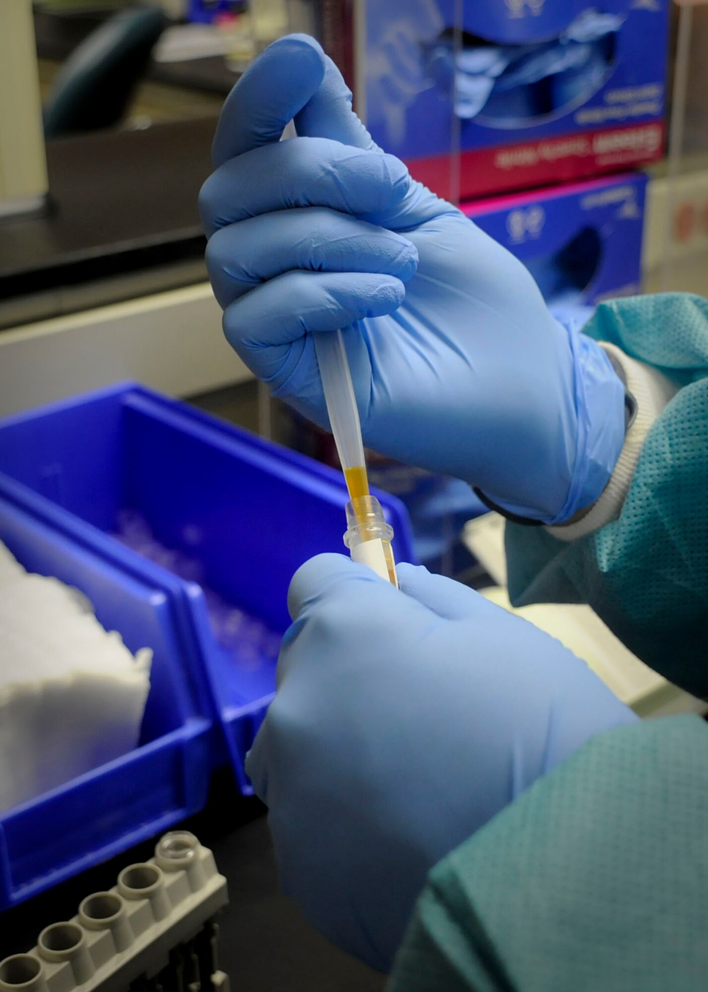 Staff Sgt. Jennifer Flavall, 27th Special Operations Medical Support Squadron, pulls blood from a test tube at the 27th Special Operations Medical Group clinic at Cannon Air Force Base, N.M., Feb. 23., to test for cholesterol, hydration and sugar levels. The group was recently received accreditation by College of American Pathologists following an onsite inspection. (U.S. Air Force photo/ Senior Airman Erik Cardenas) 