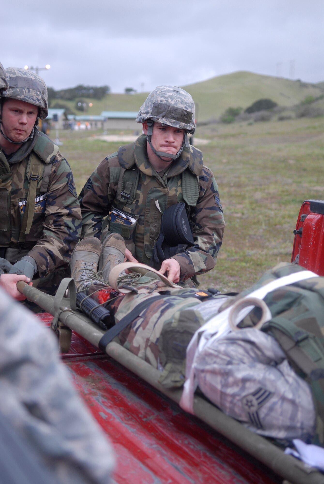 VANDENBERG AIR FORCE BASE, Calif. -- Working together, Vandenberg Airmen transport a casualty to safety during a North Star exercise here Friday, Feb. 19, 2010. North Star is a two-day exercise designed to simulate a hostile deployment environment. (U.S. Air Force photo/Senior Airman Ashley Reed)