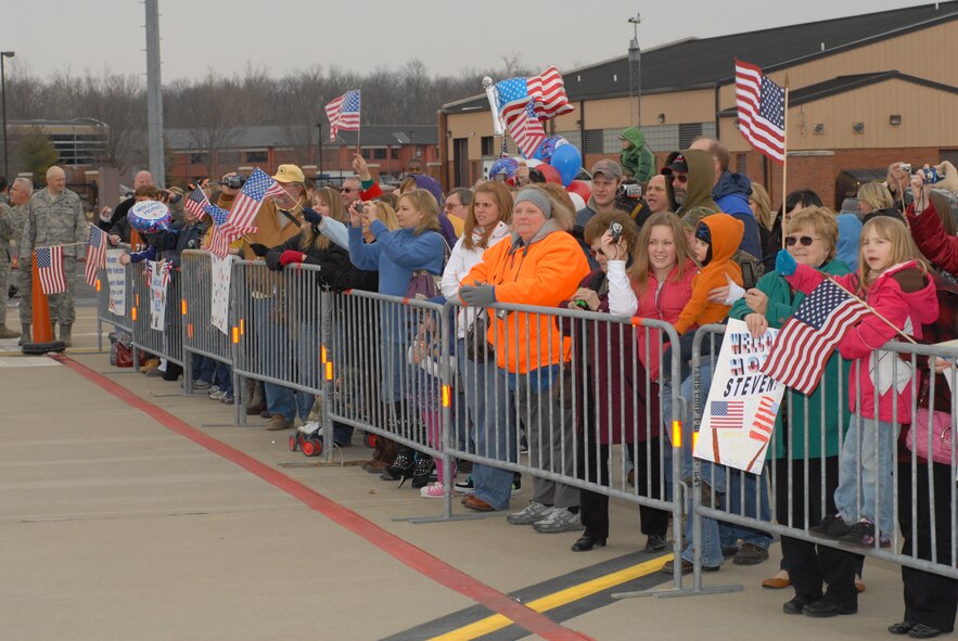 Family members, friends and co-workers eagerly await the arrival of personnel from the 126th Air Refueling Wing’s Security Forces Squadron, Illinois Air National Guard, Scott Air Force Base, Ill., as they returned home from a six month mobilization in support of Operation Iraqi Freedom. The SF personnel landed at Scott AFB Feb 12 via a 126th ARW KC-135R Stratotaker. (U.S. Air Force photo by Staff Sgt. Johnathon Orrell)