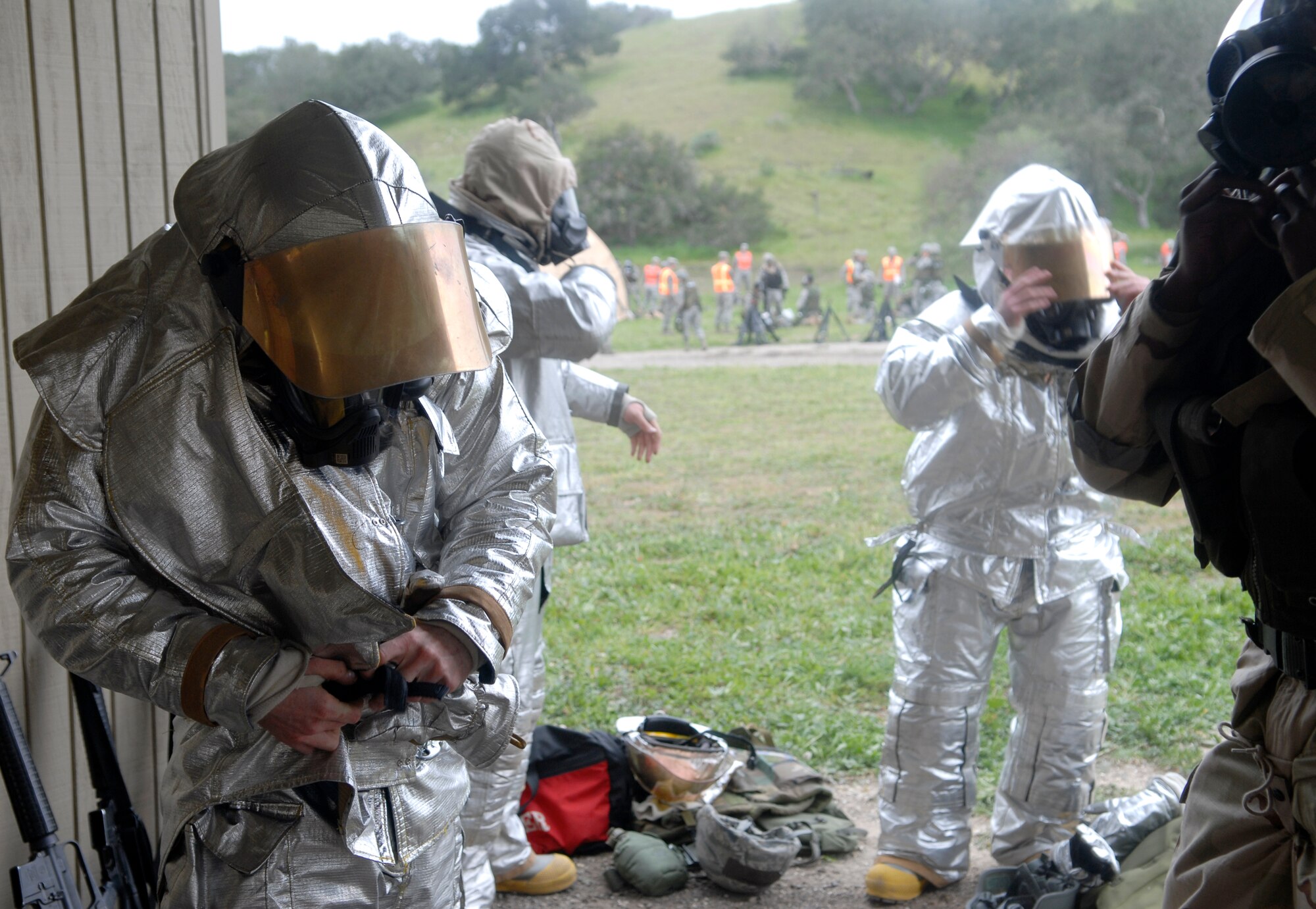VANDENBERG AIR FORCE BASE, Calif. -- With a sense of urgency, Vandenberg firefighters utilize mission oriented protective posture gear at the North Star site here Thursday, Feb. 18, 2010. MOPP gear is specifically used for protection against chemical attacks; all Airmen at North Star receive training on how to use this equipment properly. (U.S. Air Force photo/Senior Airman Ashley Reed)