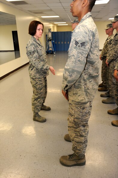 100224-F-6838W-004
SHAW AIR FORCE BASE, S.C. -- Staff Sgt. Erica Larsen, 20th Fighter Wing Honor Guardsman, directs her flight during a drill. Staff Sgt. Larsen was recently selected as the 20th FW Honor Guard NCO of the Year for 2009. (U.S. Air Force photo/Airman 1st Class Neil D. Warner)
