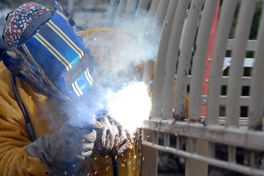 EGLIN AIR FORCE BASE, Fla. -- A construction worker welds the steel frame of the Eglin Conference Center walkway canopy, Feb. 24. The canopy will receive repairs before it is recovered. (U.S. Air Force photo/ Airman 1st Class Anthony Jennings)