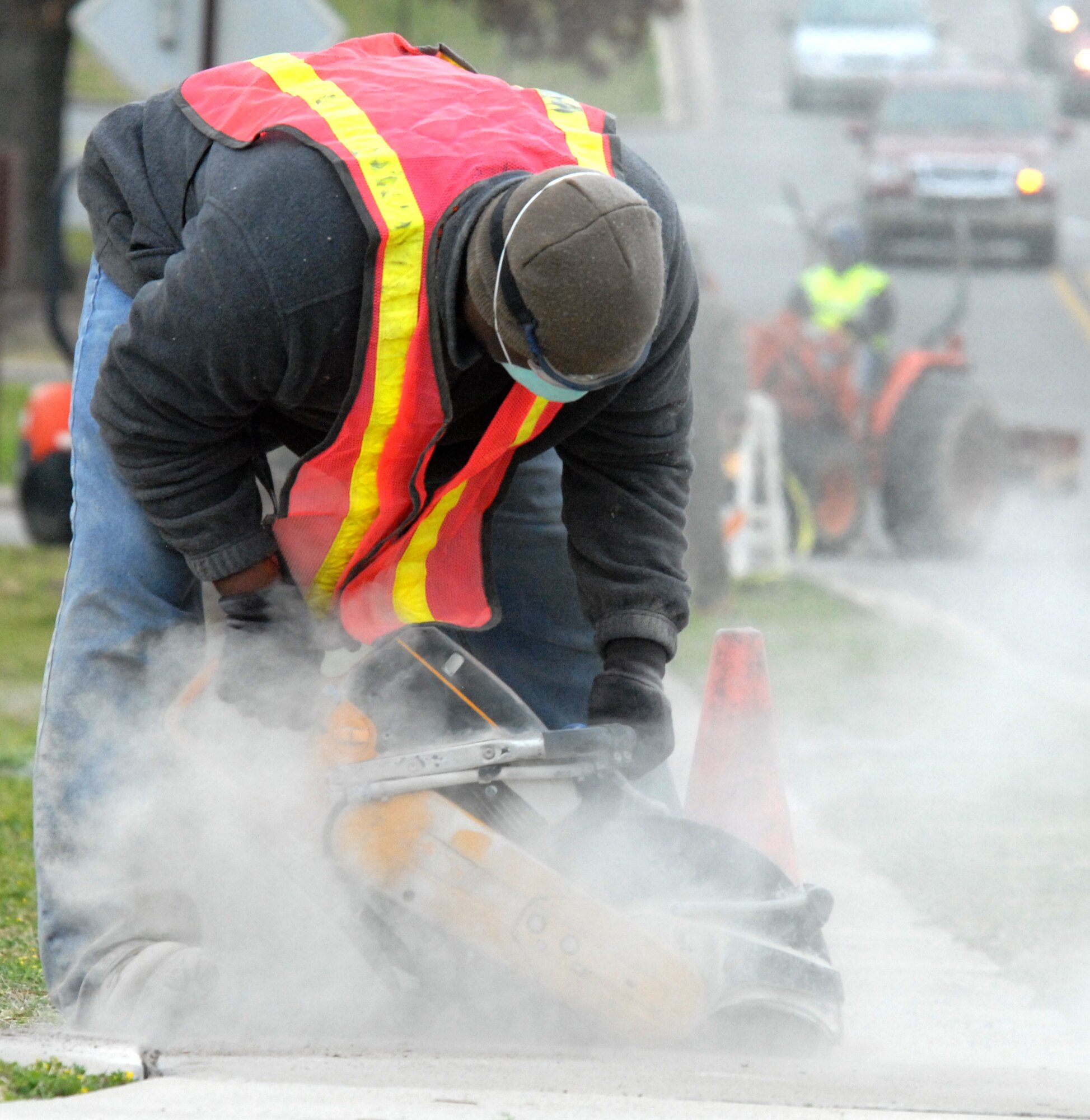EGLIN AIR FORCE BASE, Fla. -- A construction worker cuts into the sidewalk next to Dorm 17, Feb. 24. The work will repair cracks and uneven areas of the sidewalk to improve the quality of life for personnel walking on base. (U.S. Air Force photo/ Airman 1st Class Anthony Jennings)