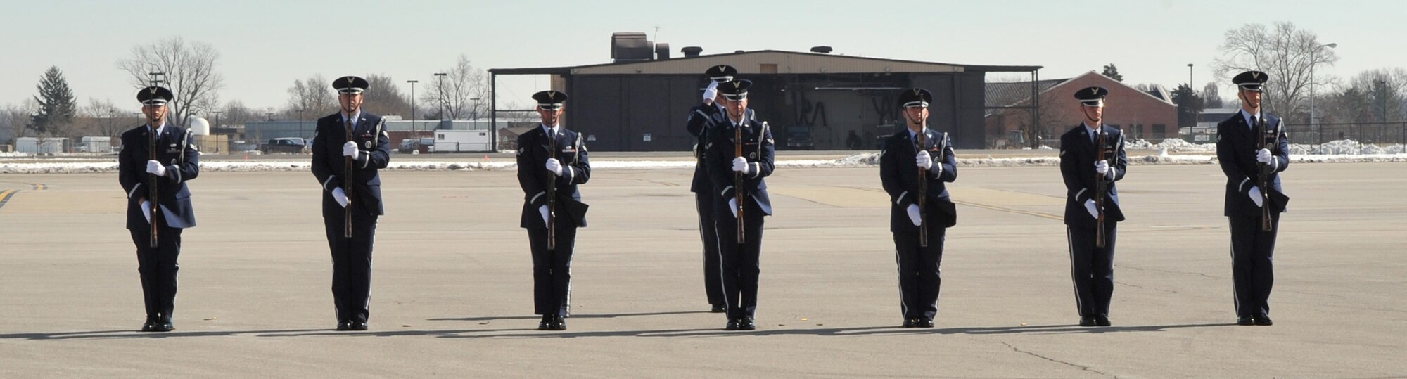 The Team Scott Honor Guard completes their 21 gun salute to Maj. Mark M. Binkowski during his memorial service Feb. 18.  He was assigned to the Air Force Network Integration Center at Scott AFB, Ill., and passed away from cancer Feb. 12. (Photo by Senior Airman Teresa Jennings)