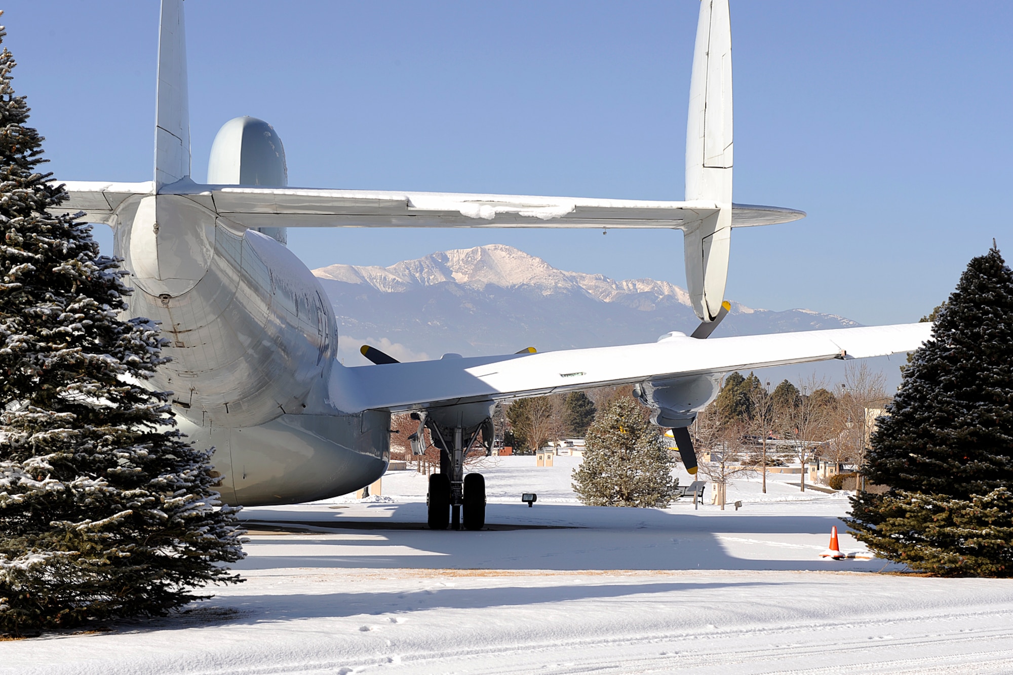 PETERSON AIR FORCE BASE, Colo. -- Pikes Peak looms on the horizon west of the Peterson Air and Space Museum, where this EC-121 “Warning Star” airborne radar aircraft is displayed with other historical aircraft. The Peterson Air and Space Museum highlights the Peterson AFB heritage and includes 22 aircraft and missiles on display. For information on the museum, call 556-4915. (U.S. Air Force photo/Larry Hulst)