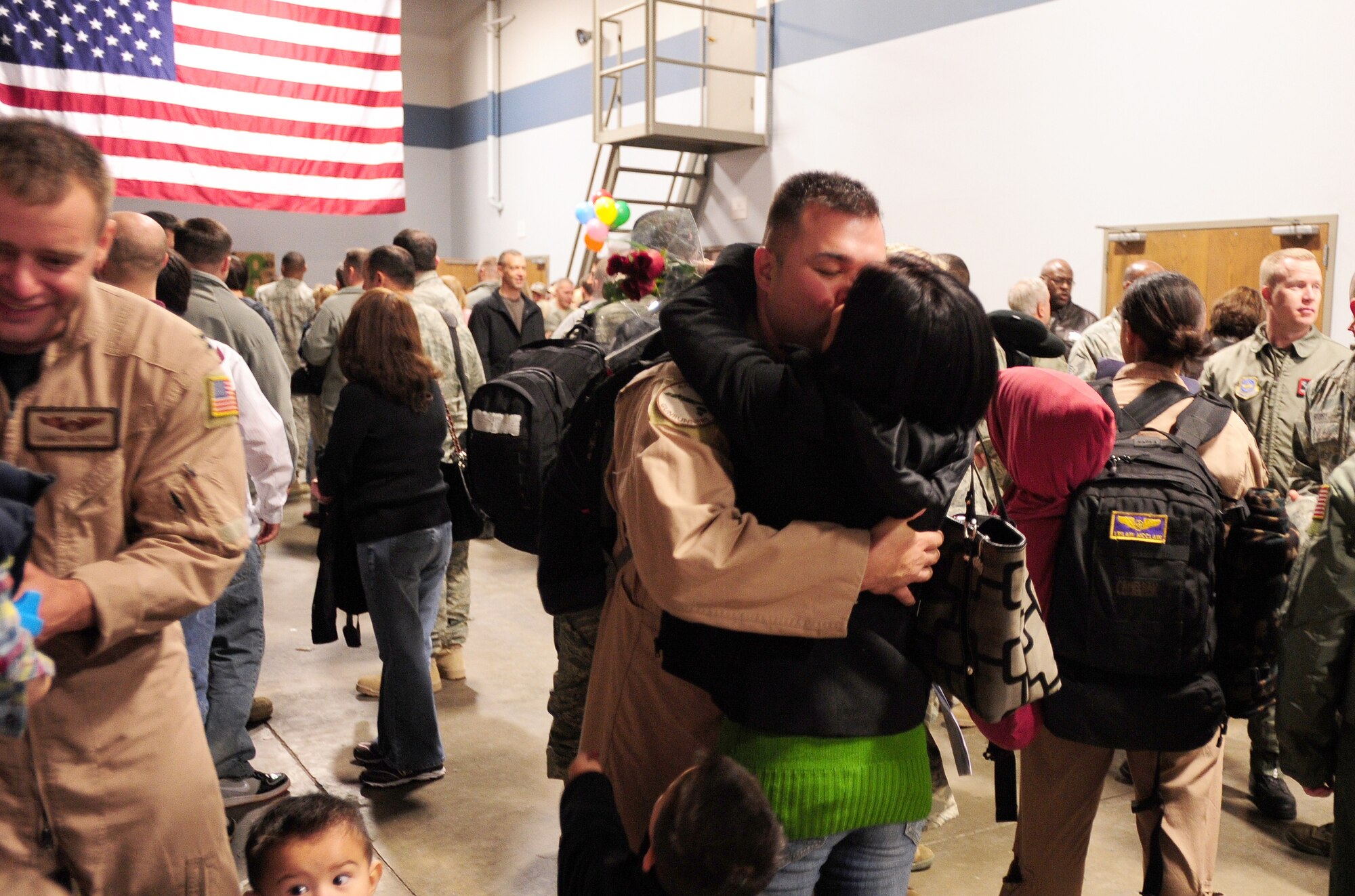 An Airman embraces a loved one upon his return Feb. 23 from his deployment to Afghanistan. More than 150 Little Rock Airmen were welcomed home by loved ones from their deployment in support of operation Enduring Freedom. (U.S. Air Force photo by Senior Airman Steele C. G. Britton)