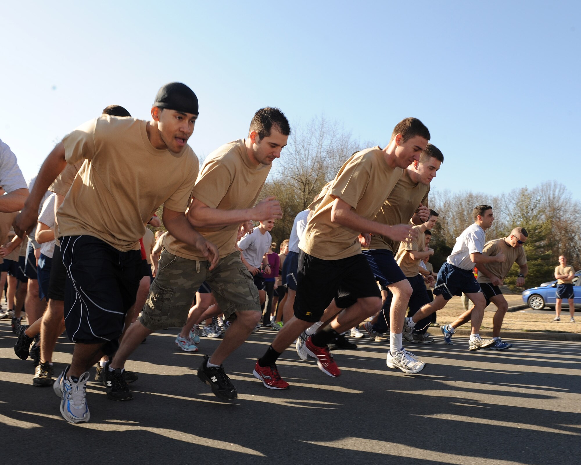 Runners sprint off the starting line of the 5K Haiti Relief Run Feb. 19. The 5K run raised more than $1,500 to support earthquake relief efforts in Haiti. (U.S. Air Force photo by Staff Sgt. Chad Chisholm)