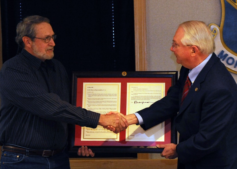 DYESS AIR FORCE BASE, Texas –  Texas Congressman Randy Neugebauer presented Danny Dobbs, George Denslow, Staff Sgt. Daniel Thatcher and Ronald Miller with the Department of Energy’s Federal and Water Management Award here Feb. 22. In 2008 Dyess Air Force Base was able to save more than 160 million gallons of water and reduced energy consumption by 16.5 percent saving more than $1 million. The award, sponsored by the Department of Energy's Federal Energy Management Program, is given annually to recognize outstanding contributions toward increased energy efficiency, renewable energy and water conservation within the federal sector. 