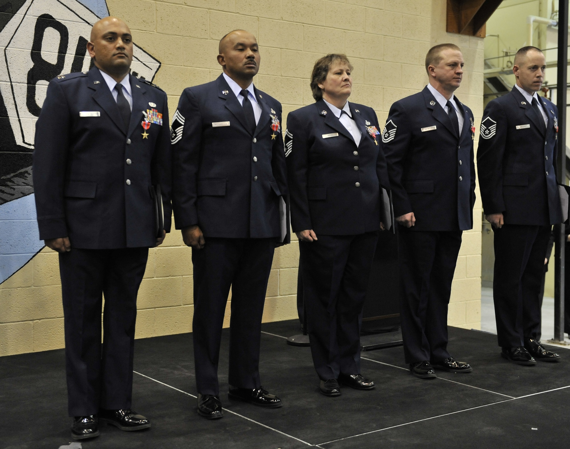 Five members of the 819th RED HORSE Squadron received Bronze Star medals for their service while deployed March through October 2009. From left to right are Capt. Birju Patel, Chief Master Sgt. Brian Richardson, Senior Master Sgt. Karen Beers, and Master Sgts. Vernon Moncur and William Brooks. (U.S. Air Force photo/John Turner)