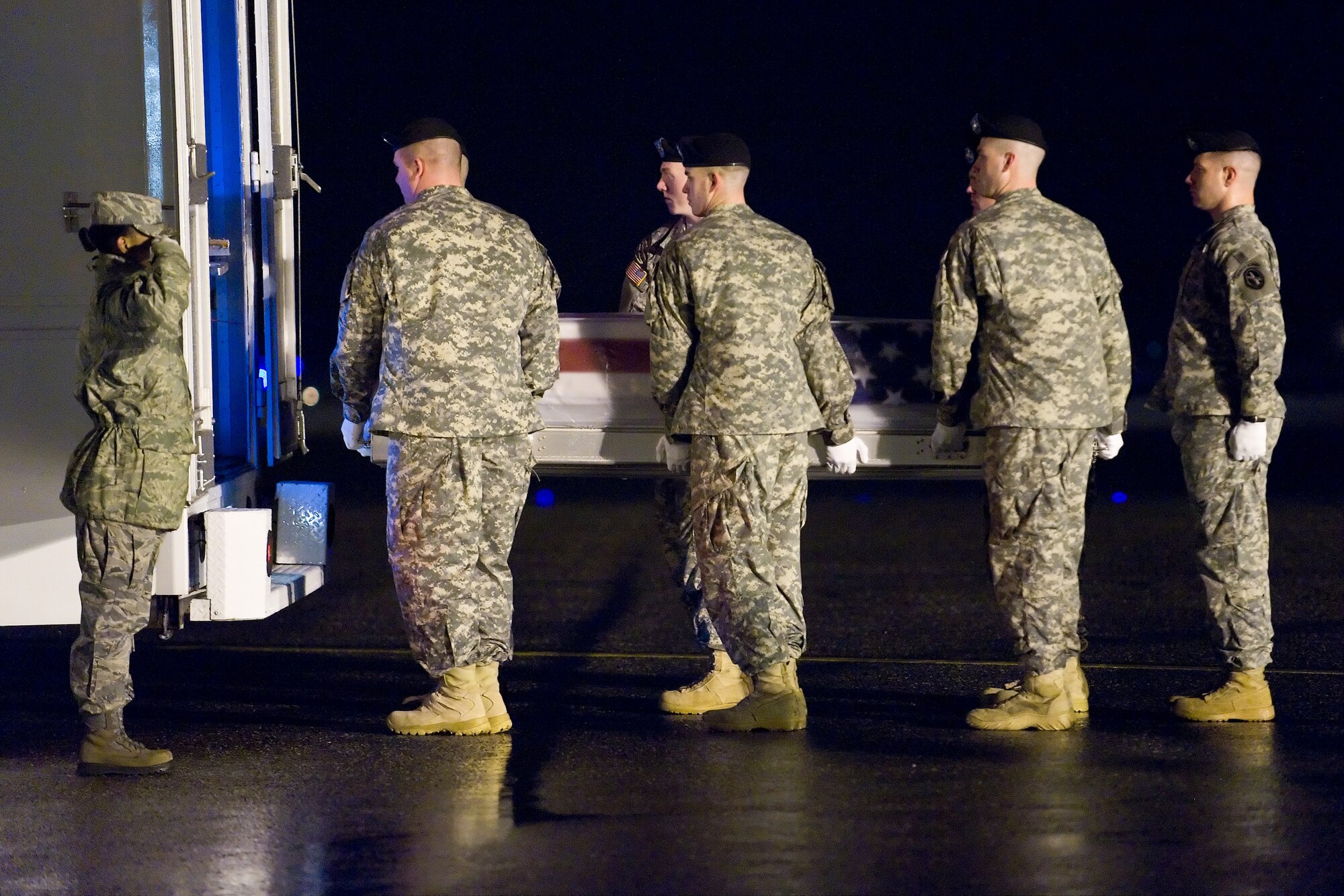 A U.S. Army carry team transfers the remains of Army Staff Sgt. Michael D. Cardenaz, of Corona, Calif., at Dover Air Force Base, Del., February 22. (U.S. Air Force photo/Roland Balik)