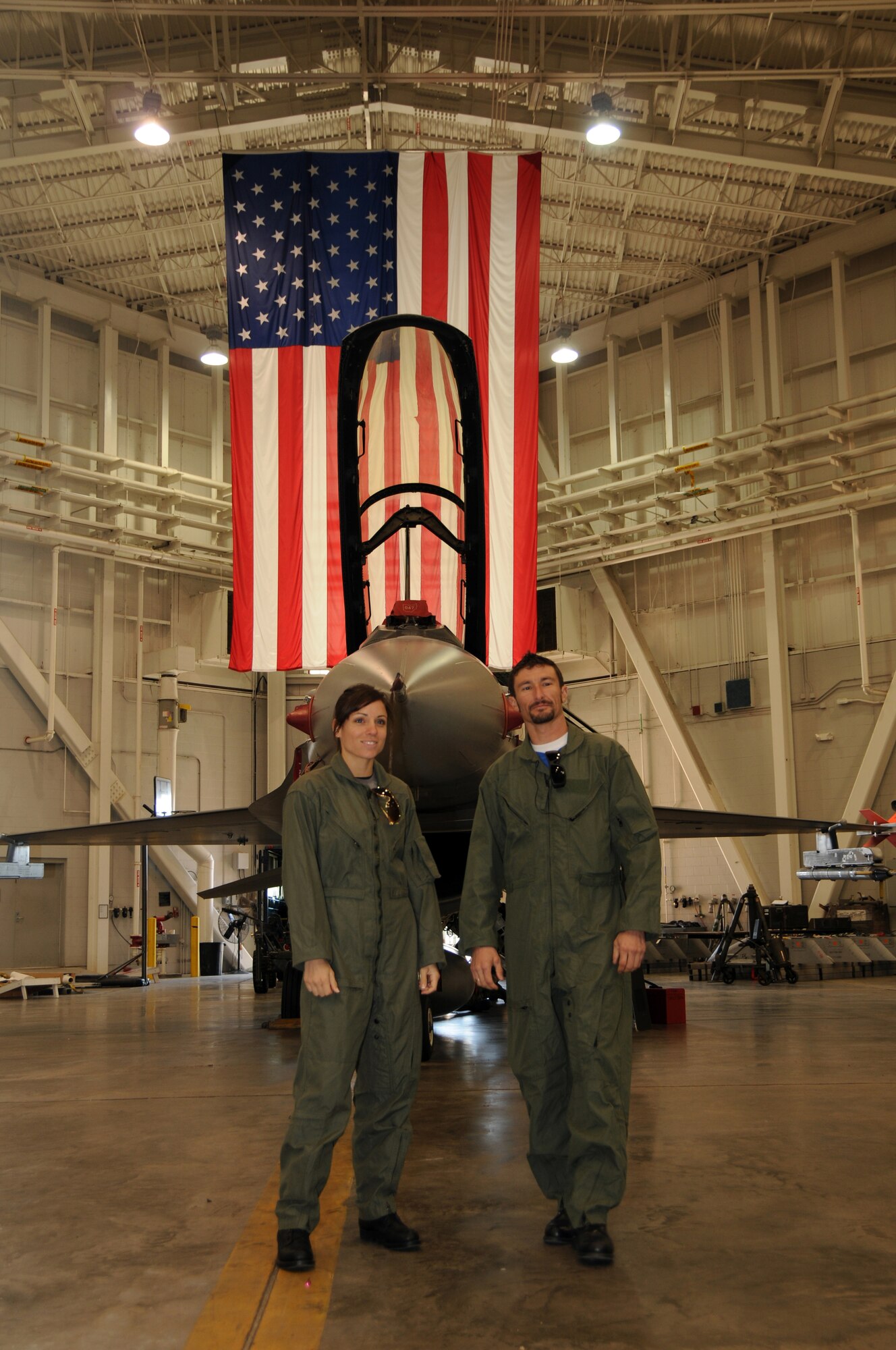 Professional motorcycle road racers Josh Hayes and Melissa Paris pose for a photo prior to receiving an orientation flight Feb. 17, 2010 in the F-16 Fighting Falcon at Gulfport Combat Readiness Training Facility, Gulfport, Miss.  Their flight was facilitated by the 178th Fighter Wing, Springfield, OH while deployed to Gulfport, Miss.