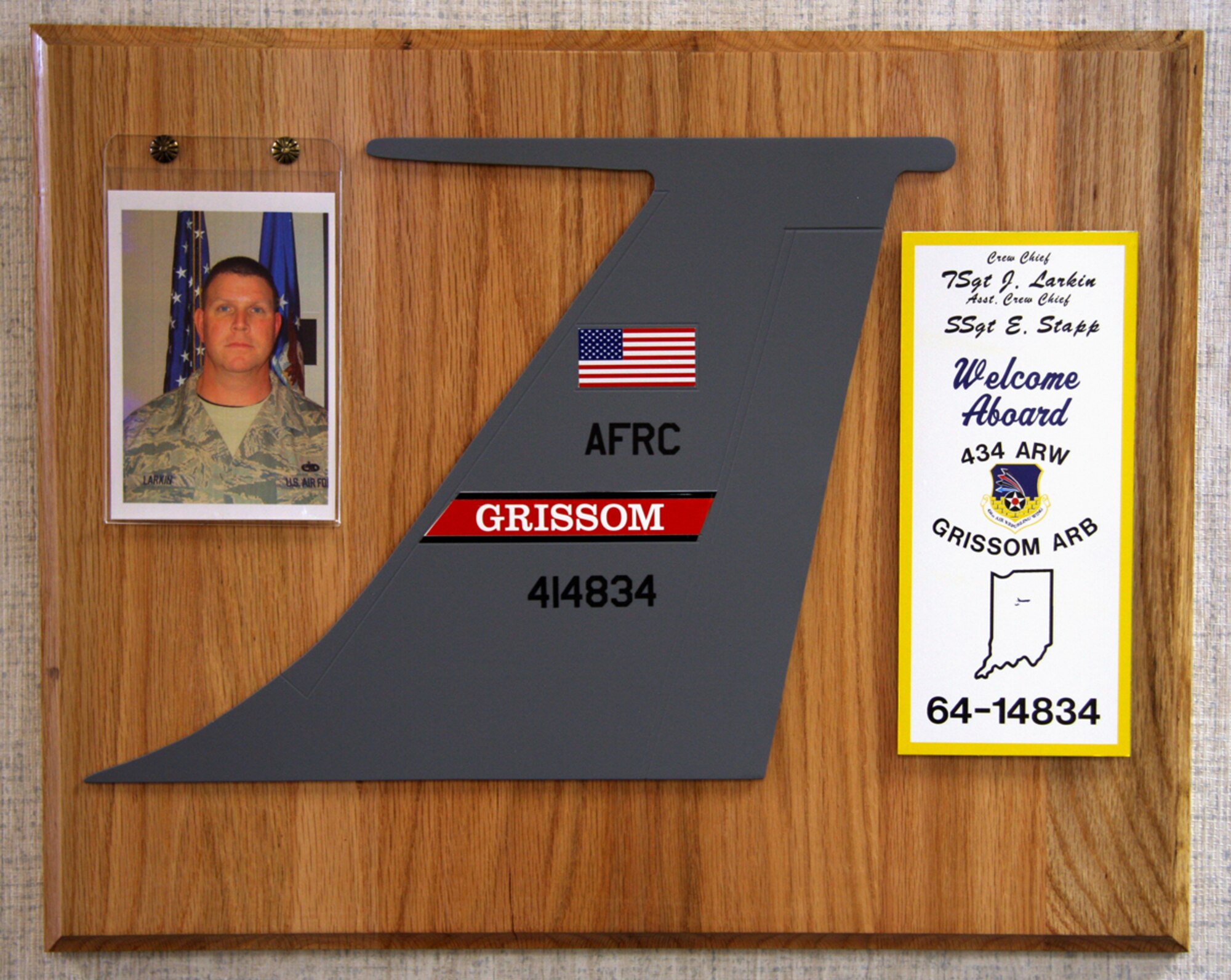 GRISSOM AIR RESERVE BASE, Ind., -- A plaque recognizing Tech. Sgt. Jeffery Larkin and Staff Sgt. Eddie Stapp for their contributions as crew chiefs of KC-135R Stratotanker; tail number 414834; hangs in a hallway of Bldg. 595. Each crew chief and their assistant crew chiefs are recognized with similar plaques hung in the hallway. A replica of each aircraft tail as well as a corresponding replica of the signage inside the aircraft is prominently displayed next to the crew chief's picture. According to Chief Master Sgt. Diana Rogers; 434th Maintenance Group chief enlisted manager; were recently created to recognize the excellent work crew chiefs provide in maintaining Grissom's KC-135 fleet. Sergeants Larkin and Stapp are both assigned to the 434th Aircraft Maintenance Squadron. (U.S. Air Force photo/Tech. Sgt. Mark Orders-Woempner)