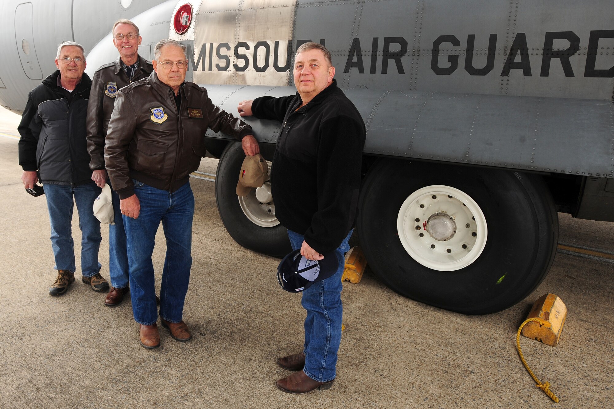 (from left) Retired Col. Carl Firkins, former Headquarters Missouri Air National Guard deputy commander; retired Chief Master Sgt. Gary McIntosh, former Missouri Air National Guard 180th Airlift Squadron chief flight engineer; retired Senior Master Sgt. Lloyd Nauman, former  180th AS chief loadmaster; and retired Senior Master Sgt. Dennis Howe, Missouri ANG 139th Maintenance Squadron dedicated crew chief, stand with a recently delivered C-130H from Rosecran Air National Guard Base in St. Joseph, Mo., on the flightline, Feb. 22. All were members of the original crew who picked up the C-130 from production in 1987, and flew as passengers for its final flight as a Missouri ANG aircraft during its delivery to the Arkansas Air National Guard’s 189th Airlift Wing. (U.S. Air Force photo by Senior Airman Steele C. G. Britton)