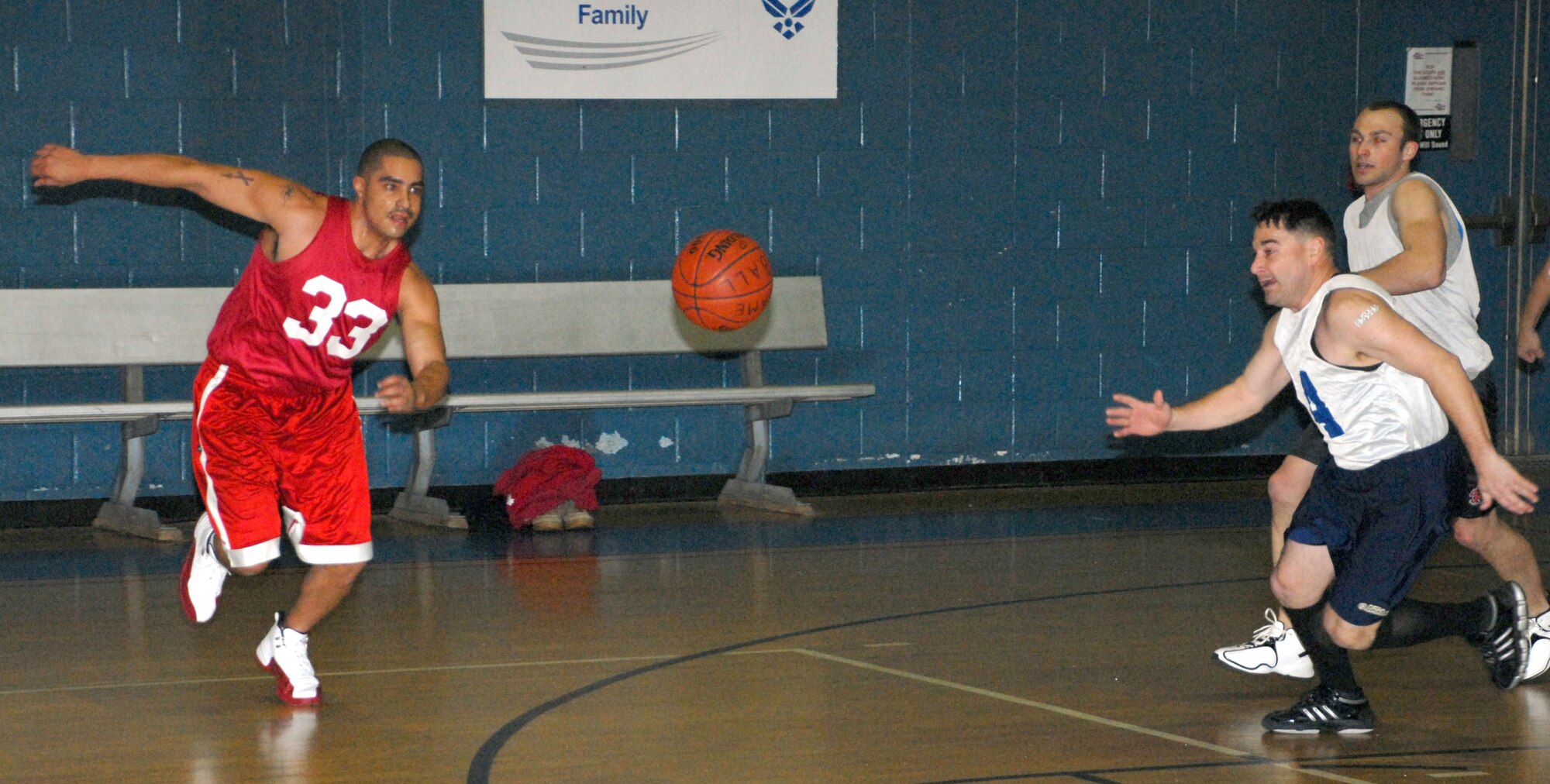 (Left) Felix Cruz, 436th FSS power forward, and Todd Barney, 3rd AS Point guard, go after a loose ball during their game Feb. 18.  The 436th FSS defeated 3rd AS 52 ? 48.  (U.S. Air Force photo/Staff Sgt. Chad Padgett)