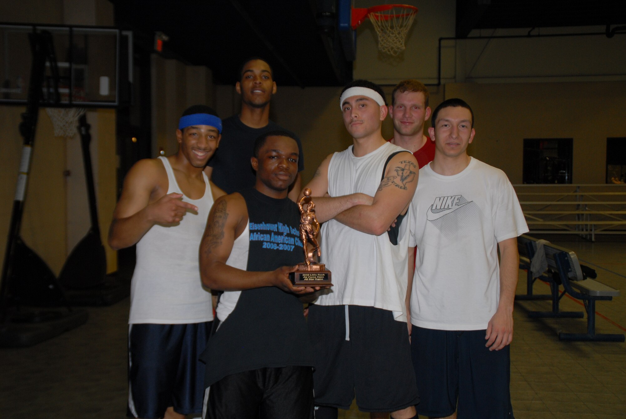The National League All-Stars pose with their Intramural All-Star Game trophy after their 85 – 82 victory over the American League All-Stars Feb. 19. The basketball competition was coordinated by the 19th Force Support Squadron fitness center.  (U.S. Air Force photo by Airman 1st Class Rochelle Clace)