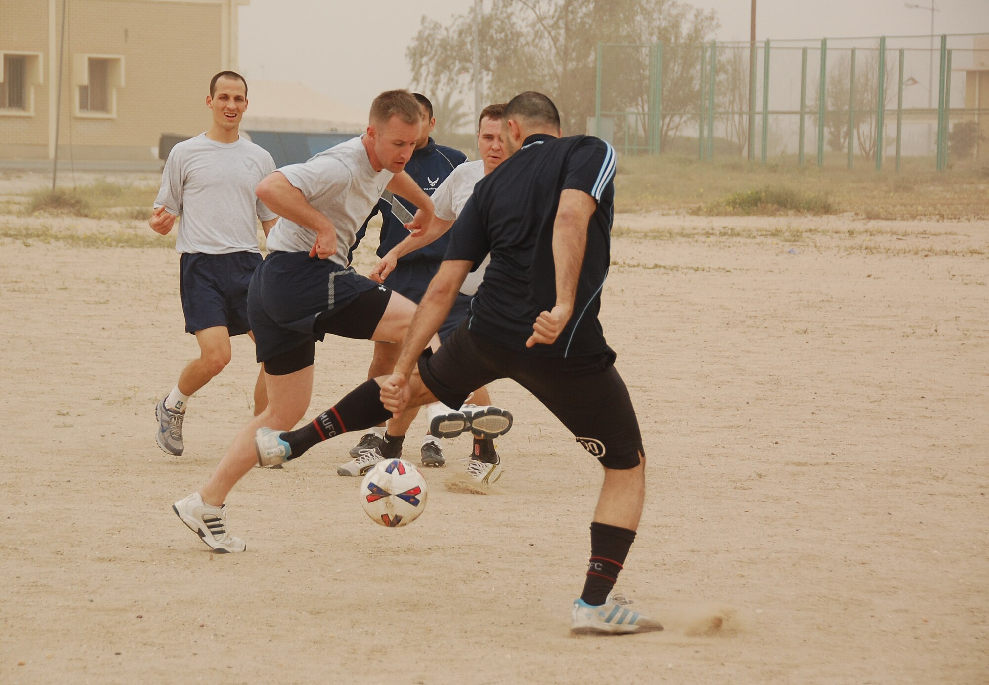 U.S. Air Force Capt. Matthew Olson fights for the ball during a soccer scrimmage Feb. 24, 2010 at an air base in Southwest Asia. The 386th Air Expeditionary Wing’s team hopes to gain the championship title from the undefeated host nation team at a later date. (U.S. Air Force photo by Staff Sgt. Lindsey Maurice/Released)