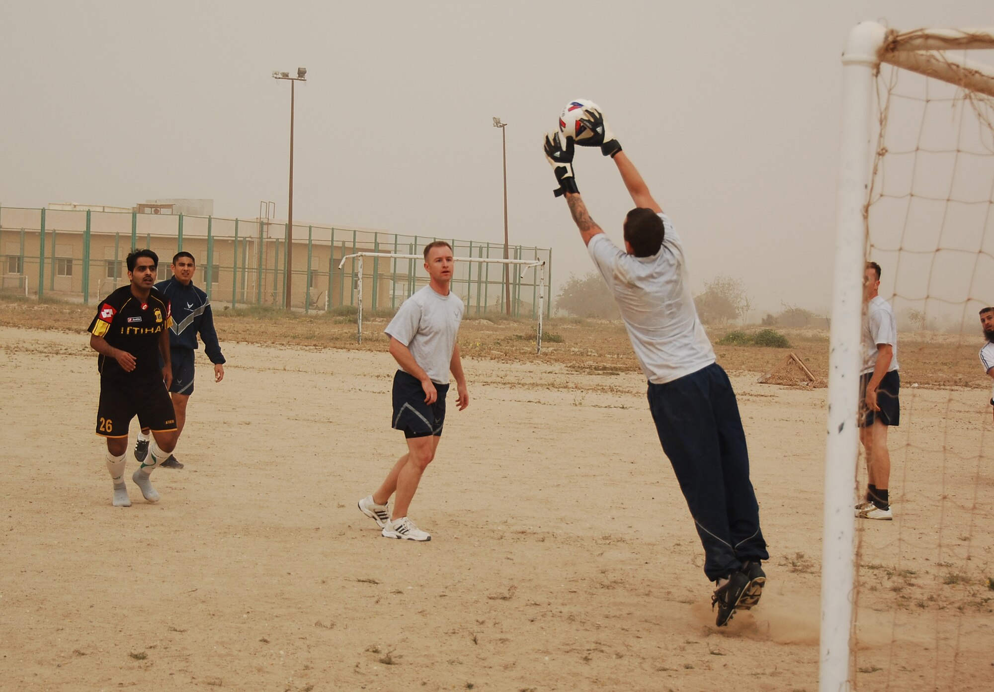 U.S. Air Force Senior Airman Mike Ackermann, blocks a goal attempt during a soccer scrimmage Feb. 24, 2010 at an air base in Southwest Asia. The 386th Air Expeditionary Wing’s team hopes to gain the championship title from the undefeated host nation team at a later date. (U.S. Air Force photo by Staff Sgt. Lindsey Maurice/Released)