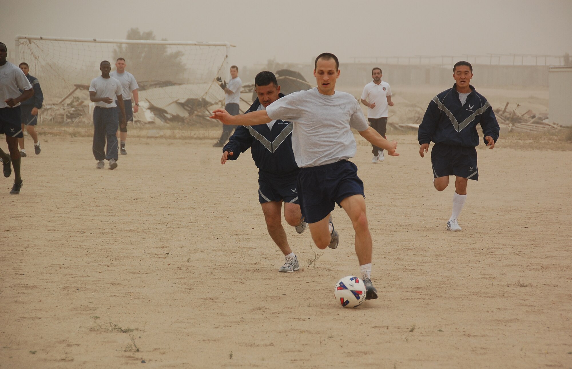 U.S. Air Force 2nd Lt. Jason Blair breaks away from the defense during a soccer scrimmage Feb. 24, 2010 at an air base in Southwest Asia. The 386th Air Expeditionary Wing’s team hopes to gain the championship title from the undefeated host nation team at a later date. (U.S. Air Force photo by Staff Sgt. Lindsey Maurice/Released)