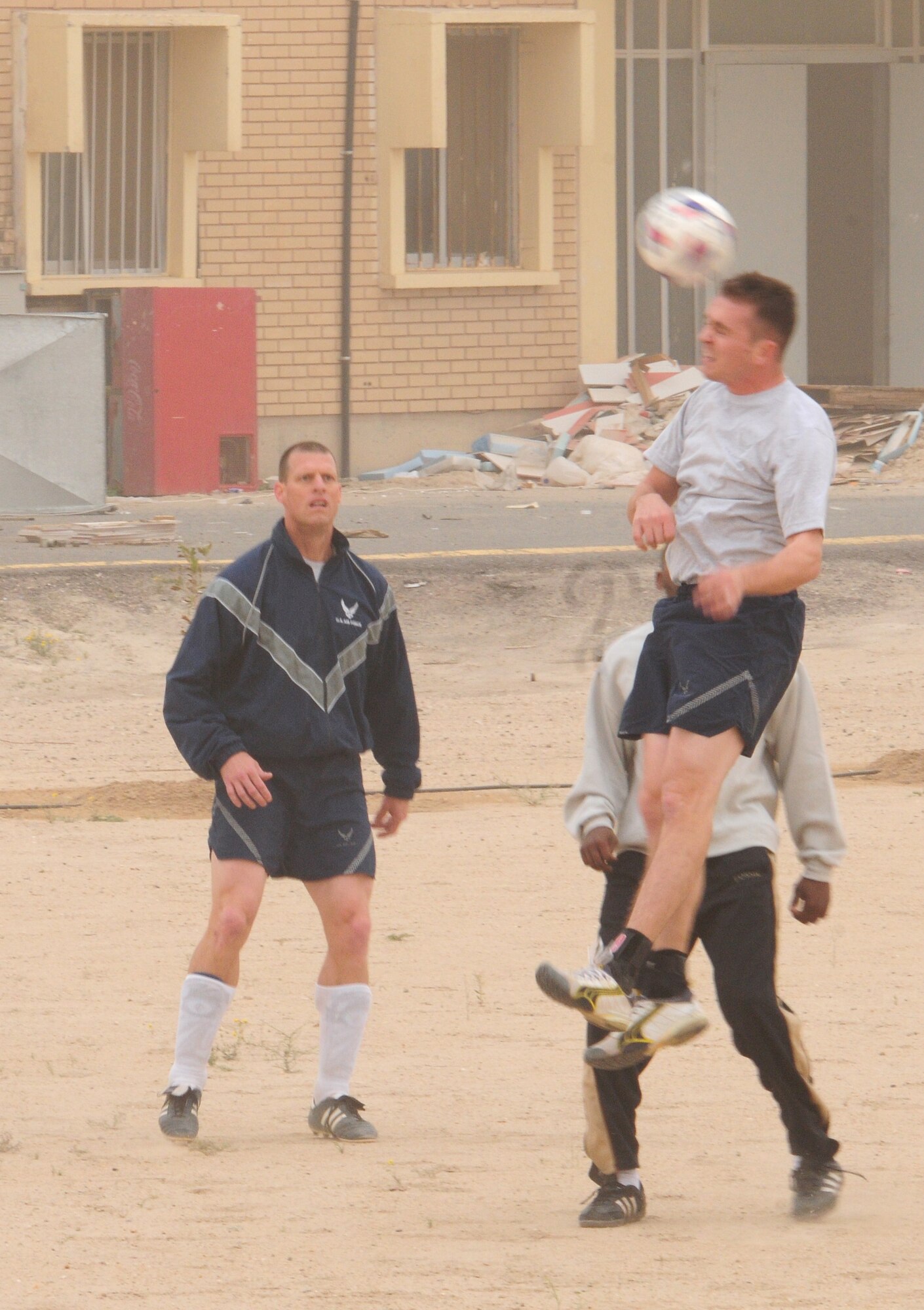 U.S. Air Force Staff Sgt. Nathan Wik meets the ball head on during a soccer scrimmage Feb. 24, 2010 at an air base in Southwest Asia. The 386th Air Expeditionary Wing’s team hopes to gain the championship title from the undefeated host nation team at a later date. (U.S. Air Force photo by Staff Sgt. Lakisha A. Croley/Released)