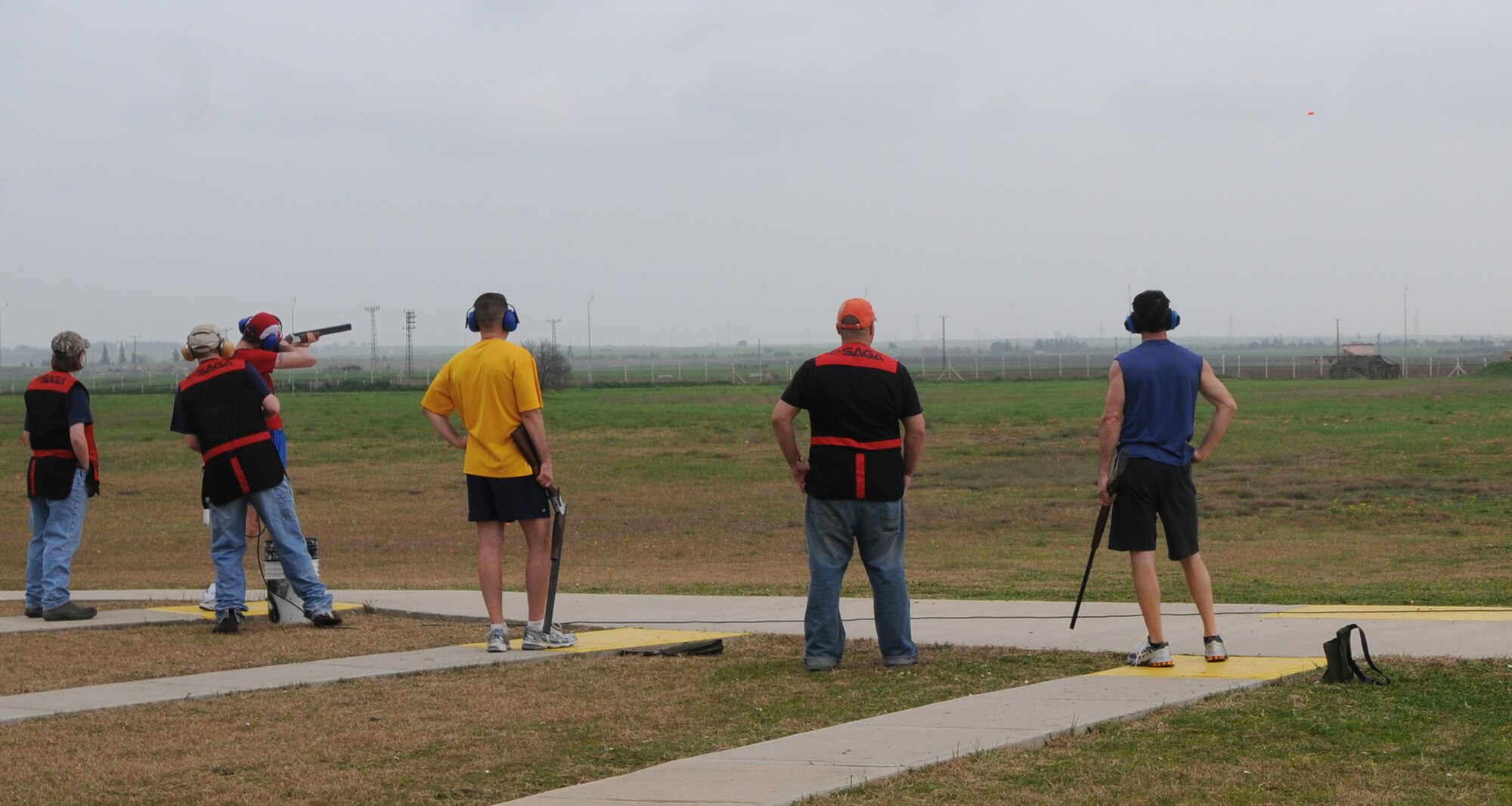 Participants of the Winterathlon line up in their appropriate spots and shoot a 12-gauge shotgun on Incirlik’s skeet range Saturday, Feb. 20, 2010.  Before participants could shoot at the range, they first had to complete a 10K run and 20K bike ride.  (U.S. Air Force photo/Senior Airman Ashley Wood) 