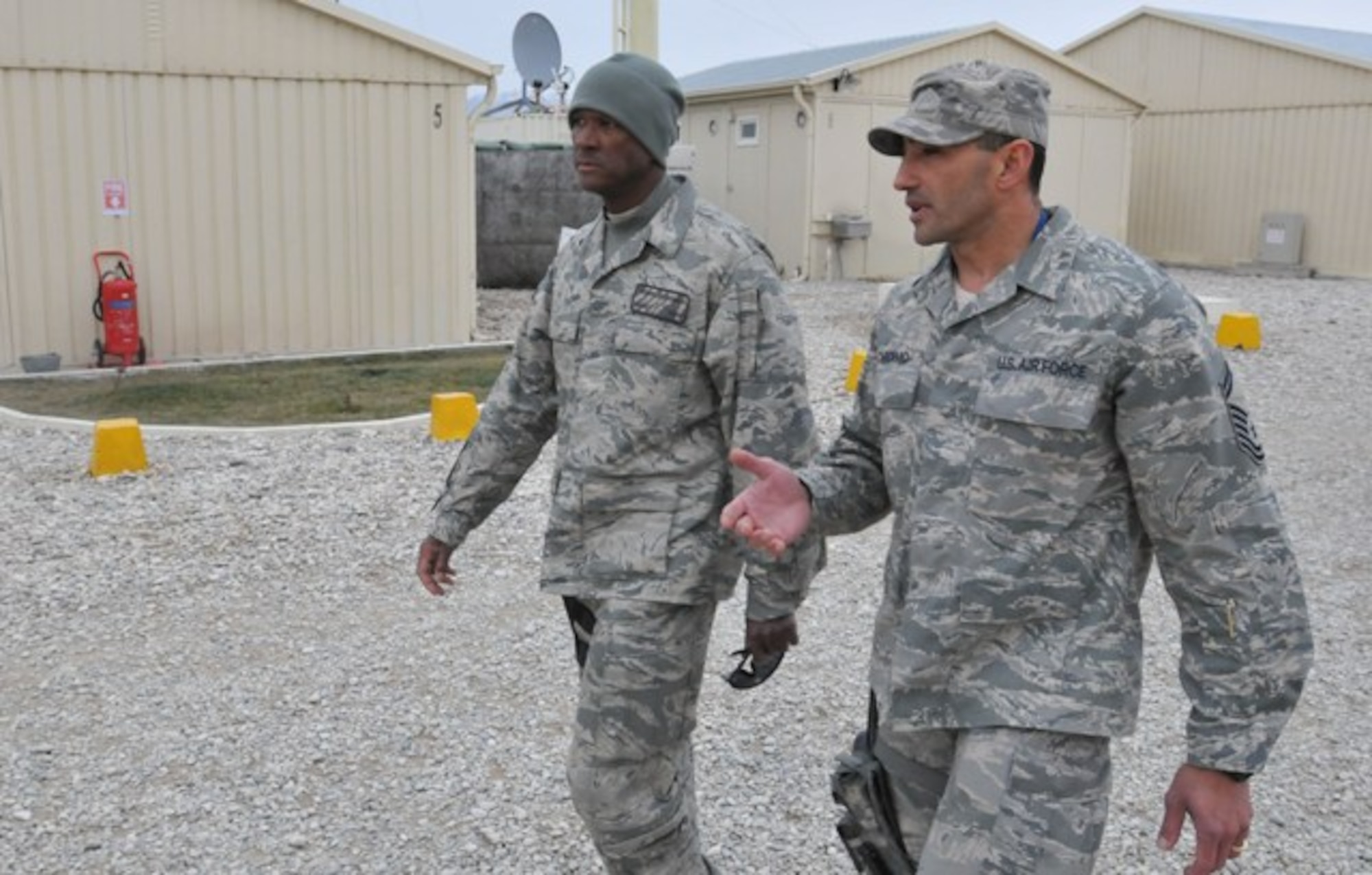 BALKH PROVINCE, Afghanistan – U.S. Air Force Senior Master Sgt. Marlin Carcamo, a senior enlisted logistics advisor for Regional Command-North from San Antonio (right), shows U.S. Air Force Chief Master Sgt. Terrell Thomas, 955th Air Expeditionary Squadron superintendent, the Afghan National Civil Order Police compound.  Carcamo is a part of the International Security Assistance Force team training and advising the ANCOP in northern Afghanistan. The leadership of the 955th AES traveled to northern Afghanistan to meet with Airmen from the 955th AES stationed in RC-North, Feb. 17 (U.S. Air Force photo by Senior Airman Andrew Caya)



