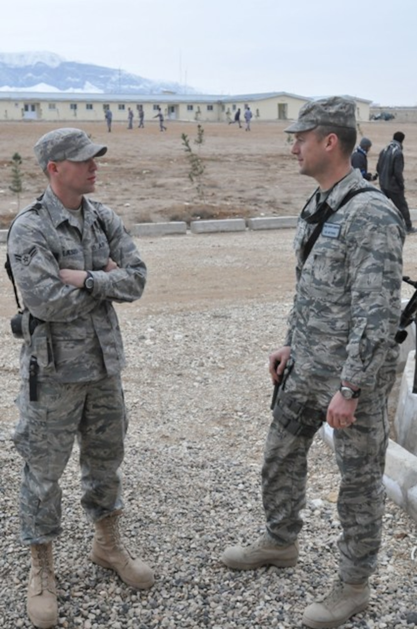 BALKH PROVINCE, Afghanistan – U.S Air Force Airman 1st Class Jordan DeJesus, a logistics mentor for Regional Command- North of Naples Fla.(left), speaks on his duties and experiences as an advisor of the Afghan National Civil Order Police at the Regional Logistics Center to U.S. Air Force Master Sgt. Gordon Comerford, 955th Air Expeditionary Wing first sergeant. The 955th AES leadership traveled from Bagram Airfield, Afghanistan to meet with Airmen who are assigned to the 955th AES and stationed in RC- North, Feb. 17. (U.S. Air Force photo by  Senior Airman Andrew Caya)

