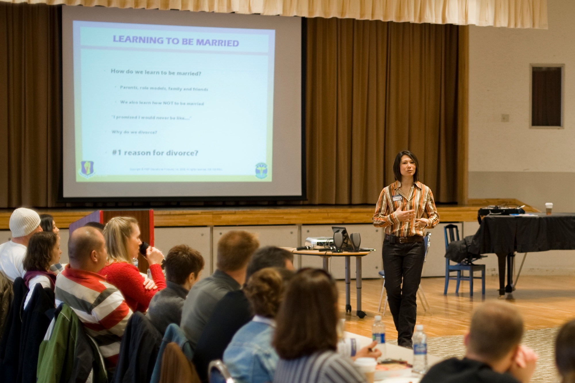 MISAWA AIR BASE, Japan -- Capt. Carla Stephany-Cox, officer in charge of family advocacy, 35th Medical Operations Squadron, gives remarks during the Love Reconnection Marriage Retreat Feb. 19 at the Mokuteki ballroom. The one-day seminar provided information to married couples on recognizing the danger signs and solving problems within relationships. Other events geared toward strengthening family will be available during the Year of the Air Force Family. (U.S. Air Force photo/Senior Airman Jamal D. Sutter)