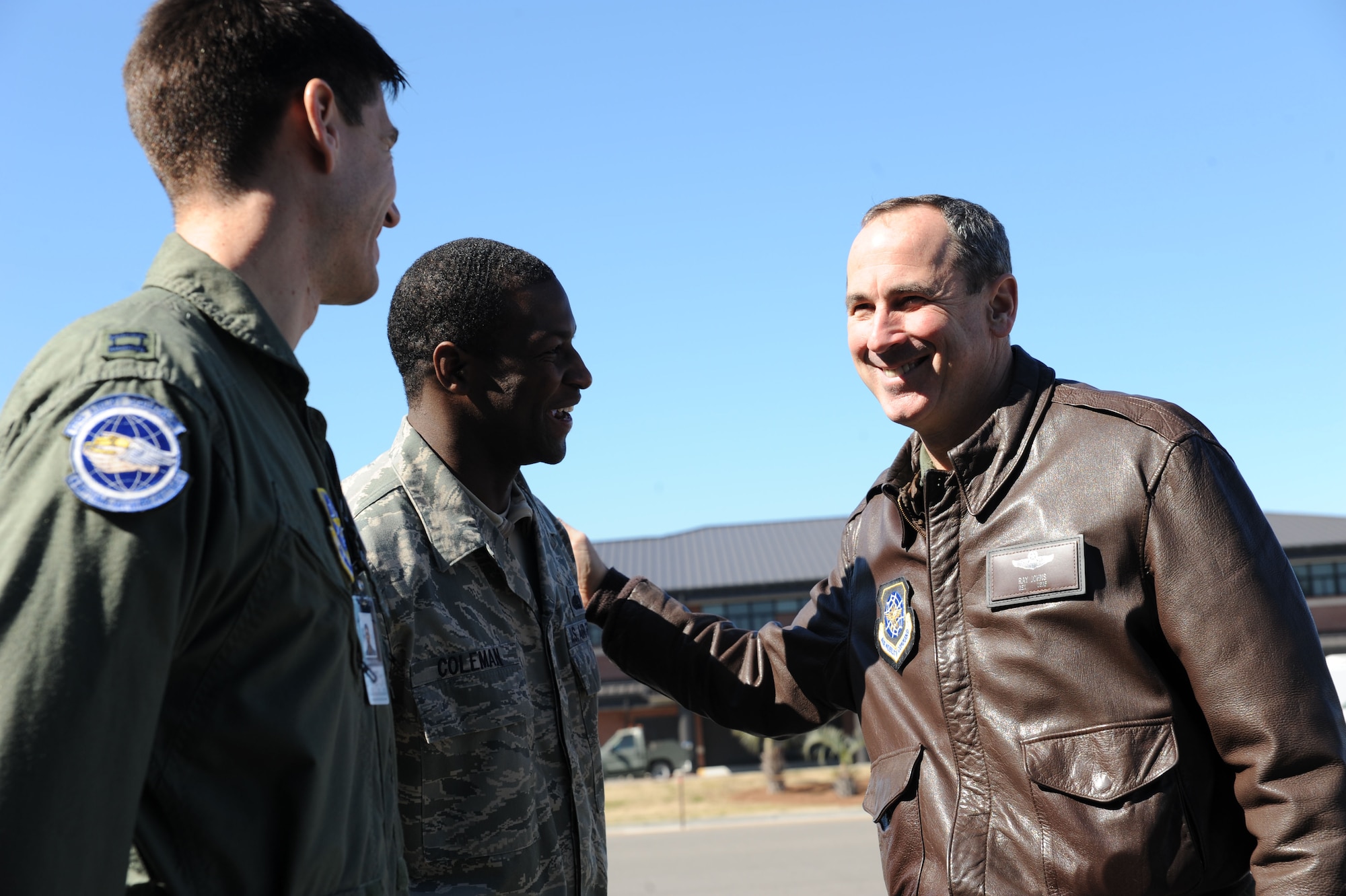 Capt. Matthew Tinker and Staff Sgt. Clinton Coleman greet Gen. Raymond Johns before he departed Joint Base Charleston Feb. 18. The general made a stop at Charleston where he was briefed on the base's Haiti stage operation before flying to Haiti for an operational assessment of the humanitarian mission there. General Johns is the commander of Air Mobility Command, Captain Tinker is a pilot with the 17th Airlift Squadron and Sergeant Coleman is the NCO in charge for wing protocol. (U.S. Air Force photo/Senior Airman Katie Gieratz)