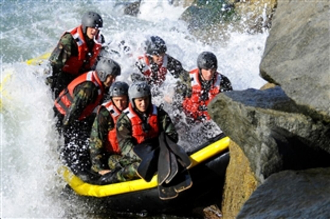 Students from the Basic Underwater Demolition/SEAL class 281 participate in a rock portage exercise on Coronado Island, Calif., Feb. 23, 2010. Rock portage is one of many physically demanding evolutions included in the first phase of training. Navy SEALs are the maritime component of U.S. Special Forces and are trained to conduct a variety of operations from the sea, air and land.