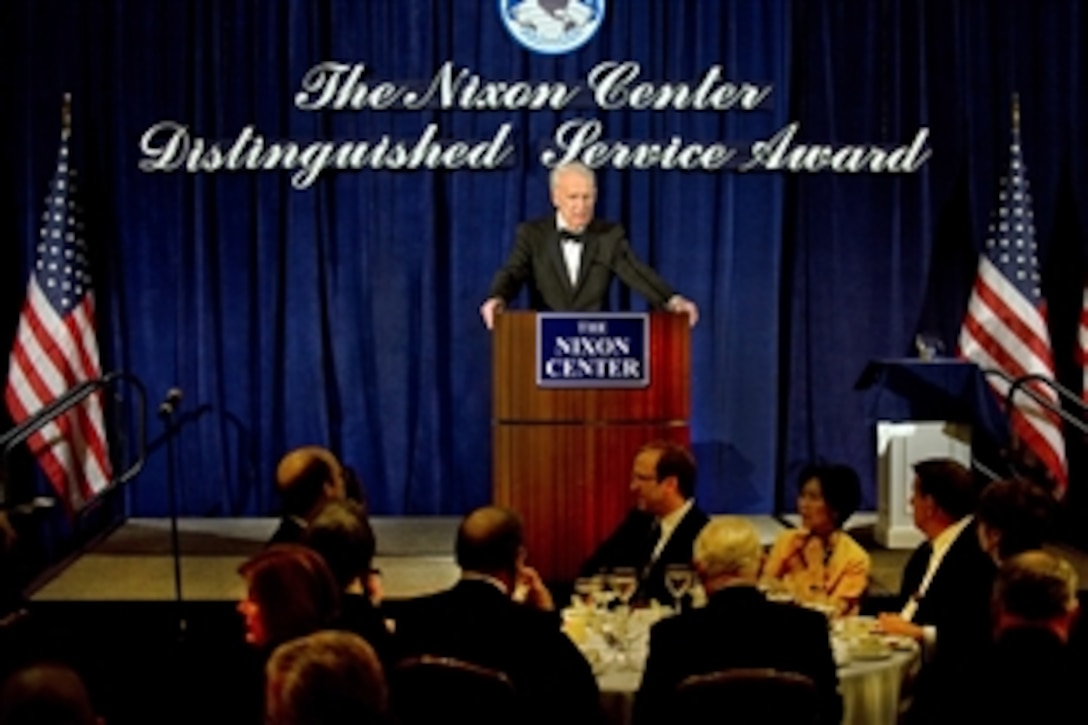Former Defense Secretary and Chairman of the Advisory Council James Schlesinger introduces Defense Secretary Robert M. Gates, recipient of the the Nixon Center Distinguished Service Award, during the think tank's award dinner in Gate's honor in Washington, D.C., Feb. 24, 2010.  