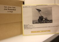 Associated Press photographer Joe Rosenthal’s photo of the flag raising on Iwo Jima is arguably the most famous news photograph in history. The original photo negative, which was taken Feb. 23, 1945, is preserved in the archives of the AP in New York.