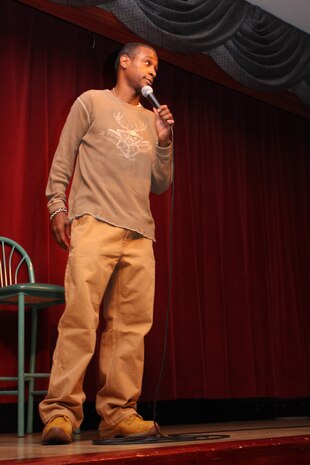 Tommy Davidson performs during the comedy show at the Club Iwakuni ballroom here Feb. 24. During the tour, Davidson::r::::n::and fellow comedian Lav Luv also visited Yokosuka Naval Base, Yokota Air Base and U.S. Army Base Camp Zama.