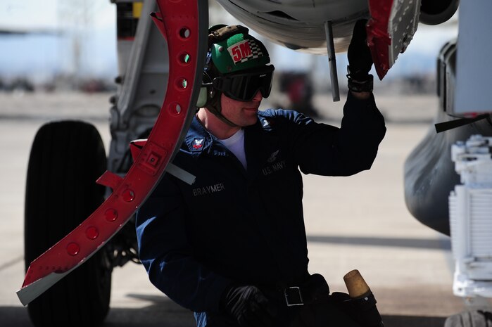 NELLIS AIR FORCE BASE, Nev. -- Petty Officer2nd Class, aviation structural mechanic Jacob Braymer, Tactical Electronic Warfare Squadron  One Three Nine (VAQ-139) from Whidbey Island, Wash. prepares a EA-6B Prowler for flight at Red Flag 10-3 Feb. 23, 2010.  Red Flag is a realistic combat training exercise involving the air forces of the United States and its allies. The exercise is conducted on the 15,000-square-mile Nevada Test and Training Range, north of Las Vegas.  (U.S. Air Force Photo by Staff Sgt. William P. Coleman/RELEASED)