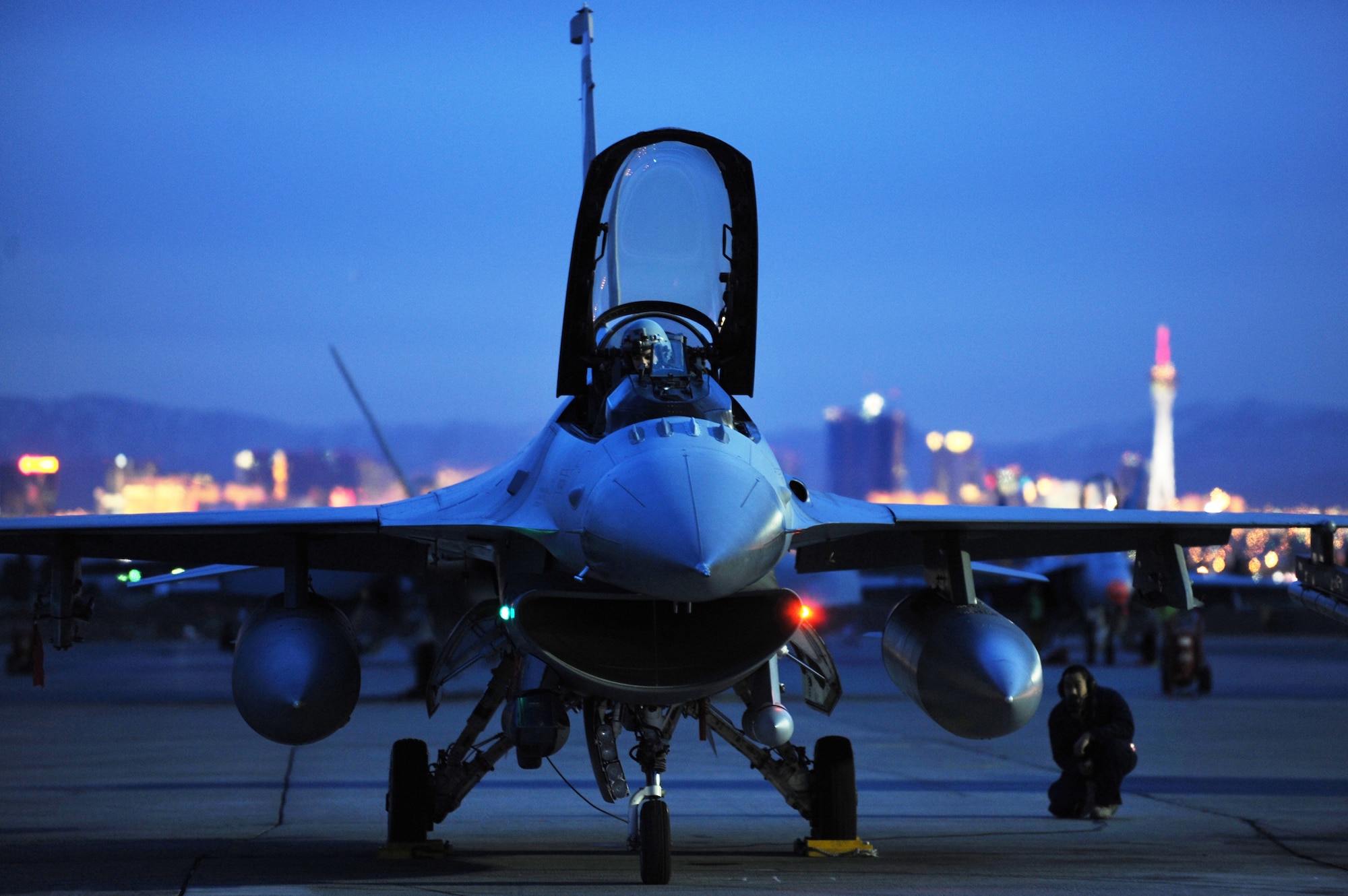 Airman 1st Class Albert Sarroca completes a pre-flight check before launching an F-16 Fighting Falcon on a night training mission at Red Flag Feb. 23, 2010, on Nellis Air Force Base, Nev. Red Flag is a realistic combat training exercise involving the air forces of the United States and its allies. Airman Sarroca is a crew chief with the 20th Aircraft Maintenance Squadron from Shaw AFB, S.C. (U.S. Air Force photo/Tech. Sgt. Michael R. Holzworth)
