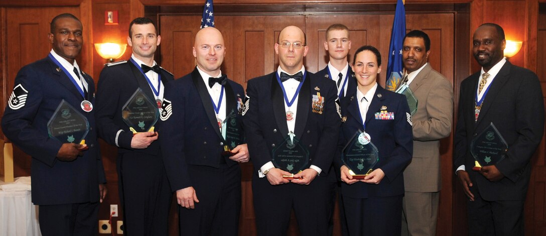 Award winners from the 89th Airlift Wing pose for a quick photo after the 89th Airlift Wing Annual Award ceremony Feb. 23 at The Club at Andrews. (U.S. Air Force photo/ Airman 1st Class Melissa Rodrigues)