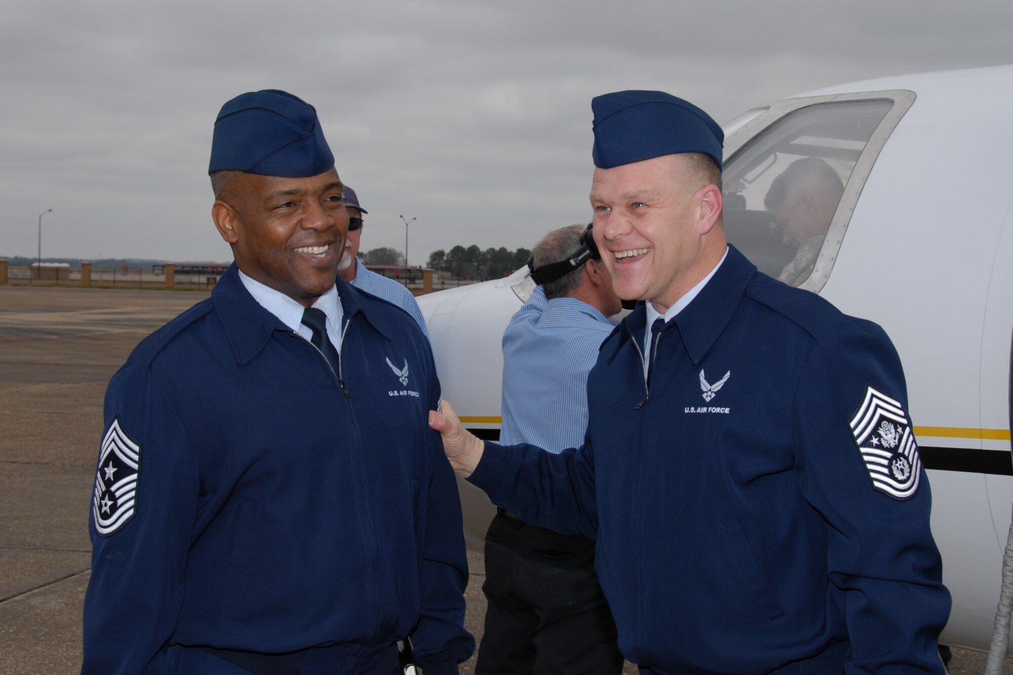 Chief Master Sgt. Brye McMillon, Air University command chief, greets Chief Master Sergeant of the Air Force James Roy on his arrival to Maxwell Air Force Base, Feb. 22. (Official Air Force Photo by Henry Hancock)