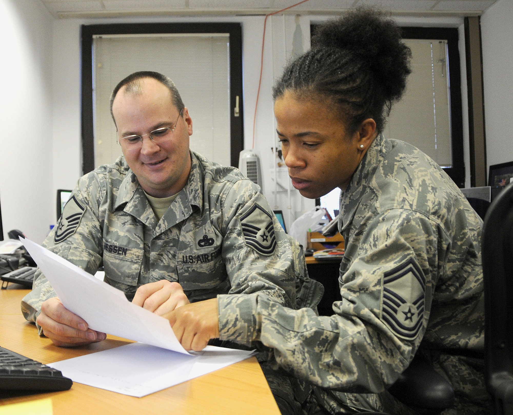 Master Sgt. Scott Jessen, Air Forces Africa air transportation manager, and Senior Master Sgt. Demetrice Webb, AFAFRICA material manager, review logistics and bed-down of forces procedures Feb. 22, 2010, following Exercise Objective Lens 2010 which ran from Feb. 8 to 21. The exercise tested the unit's ability to plan for and execute a short-notice non-combatant evacuation operation in Africa. (U.S. Air Force photo/Staff Sgt. Stefanie Torres)