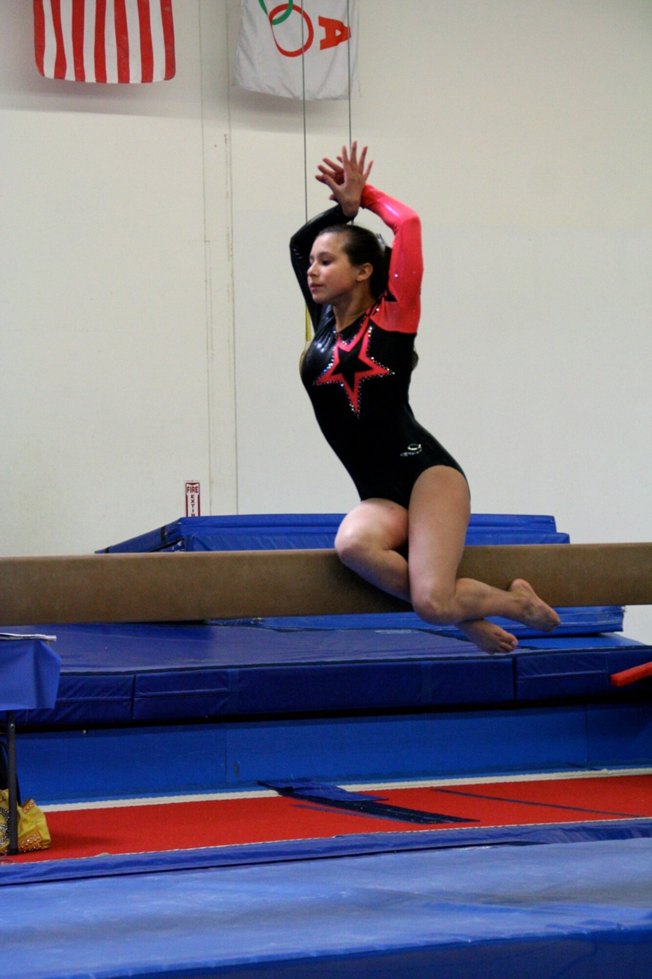 CAMARILLO, Calif. -- Genevieve Aguilar, age 14, begins her balance beam routine at the Snowflake Classic gymnastics competition here Feb. 7. Aguilar, who is with the Vandenberg Youth Programs Jets girls gymnastics Level 7 team, placed third for her routine at the competition. (Photo by Cheryl Castellenos)