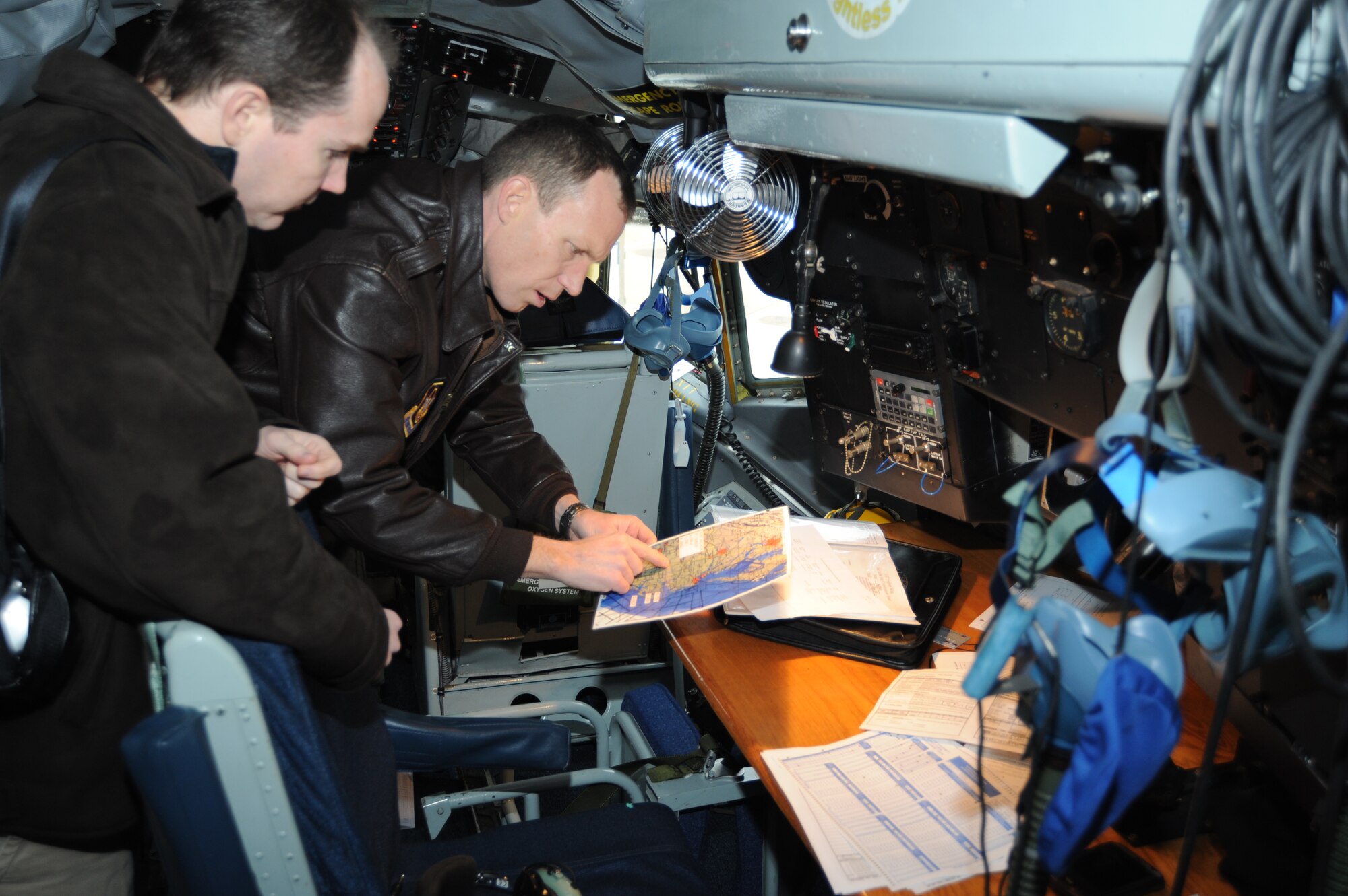 Lt. Col. Mark Deresky, pilot, 459th Operations Group reviews the flight plan with an employer during a D.C. Employer Support for the Guard and Reserve sponsored aerial-refueling flight aboard a KC-135R Stratotanker, refueling the 113th Wing (Air National Guard) co-located here at Joint Base Andrews, Jan. 22nd.  The event was hosted by the D.C. Employer Support for the Guard and Reserve, a Department of Defense national committee with a mission to gain and maintain employer support for Guard and Reserve service by recognizing outstanding support, increasing awareness of the law, and resolving conflict through mediation (JFHQ photo/TSgt William Parks).

