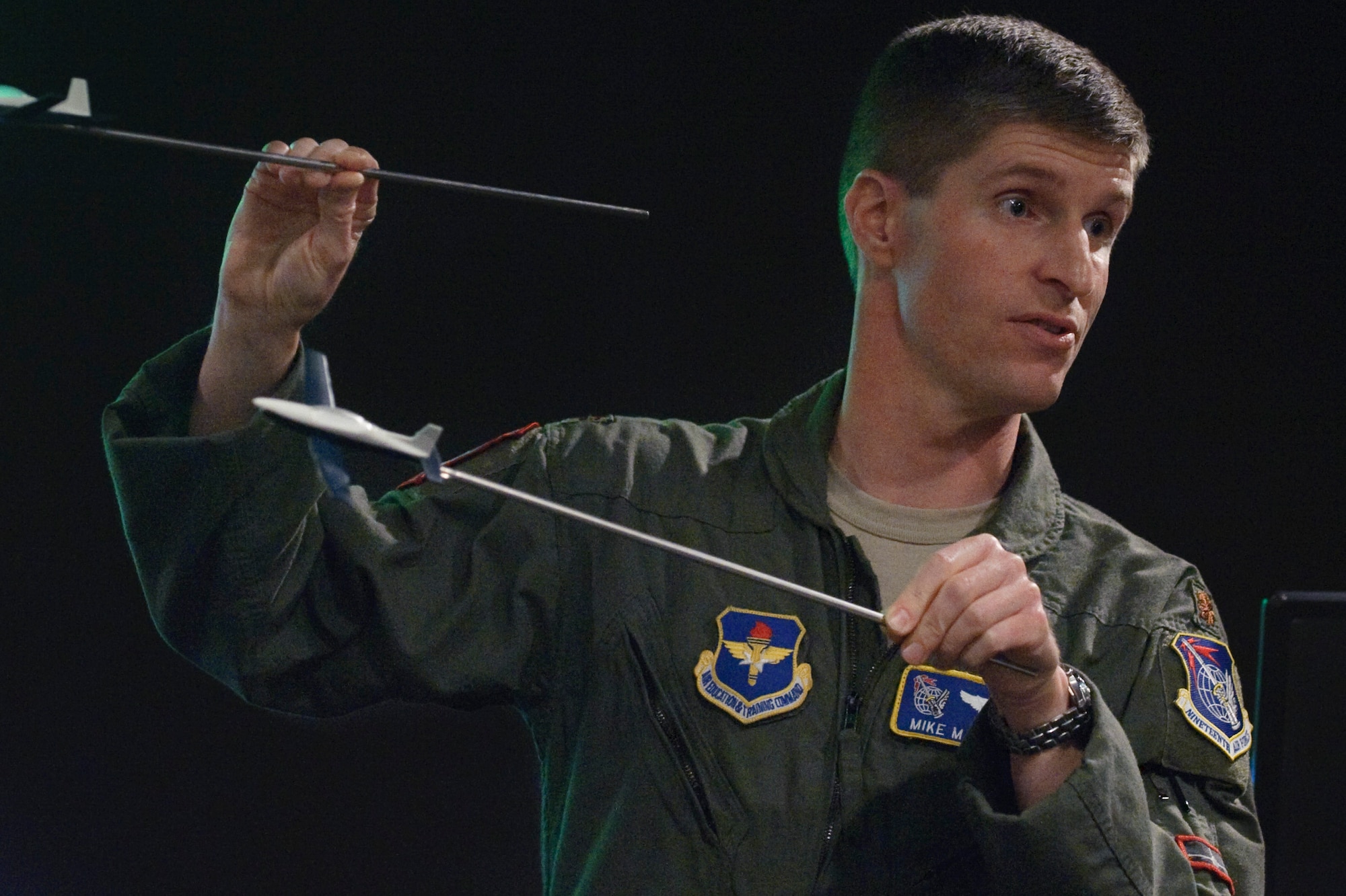 Maj. Mike Matesick, a Night Vision Goggle instructor at Randolph Air Force Base, instructs students of the NVG Academic Instructor course, how the use of properly adjusted NVGs improve aircrew's effectiveness in the air. (U.S. Air Force photo by Steve Thurow)