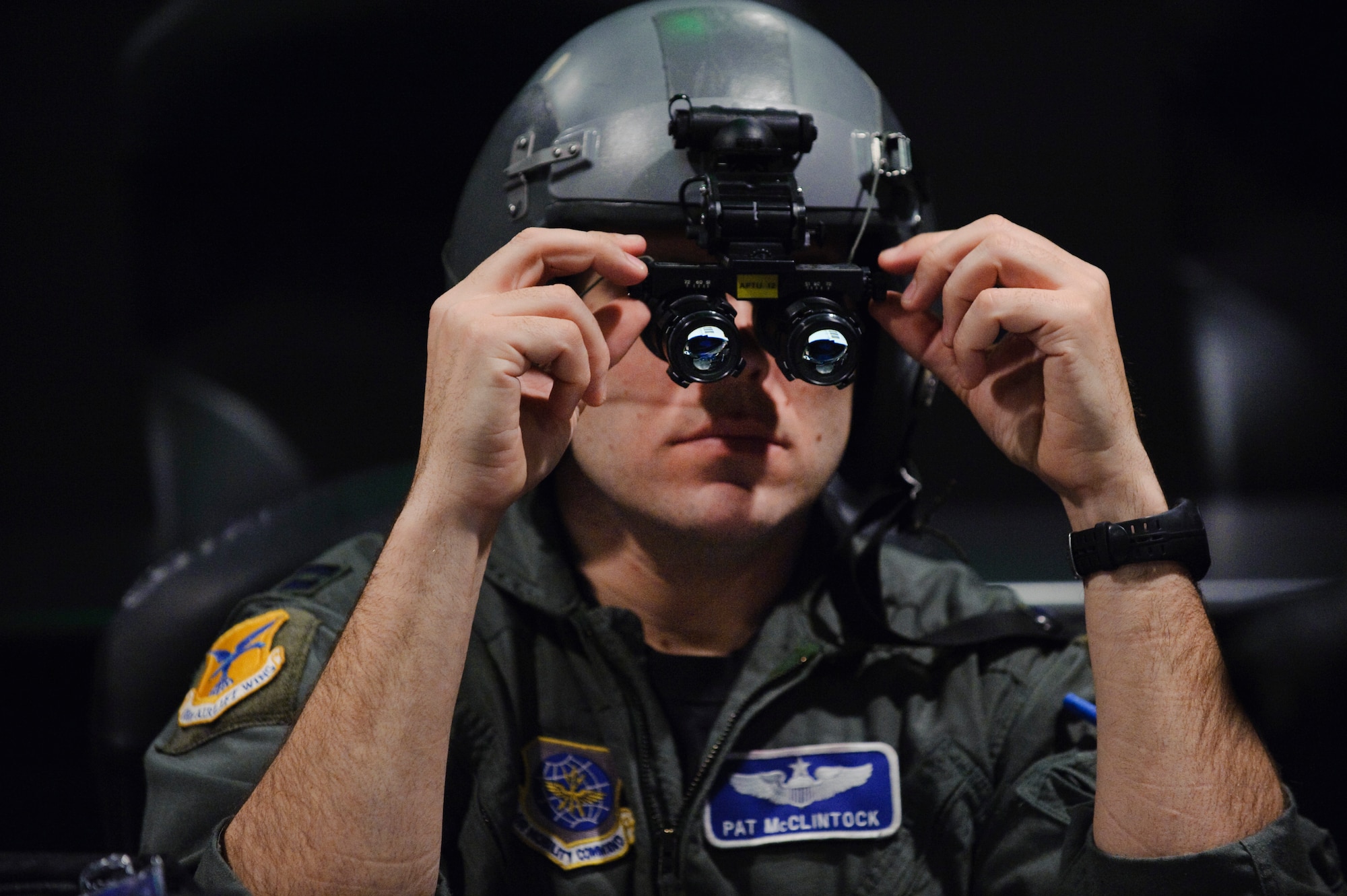 Capt. Pat McClintock, a Night Vision Goggle Academic Instructor Course student, learns how to properly adjust his NVGs at Randolph Air Force Base, Texas. (U.S. Air Force photo by Steve Thurow)