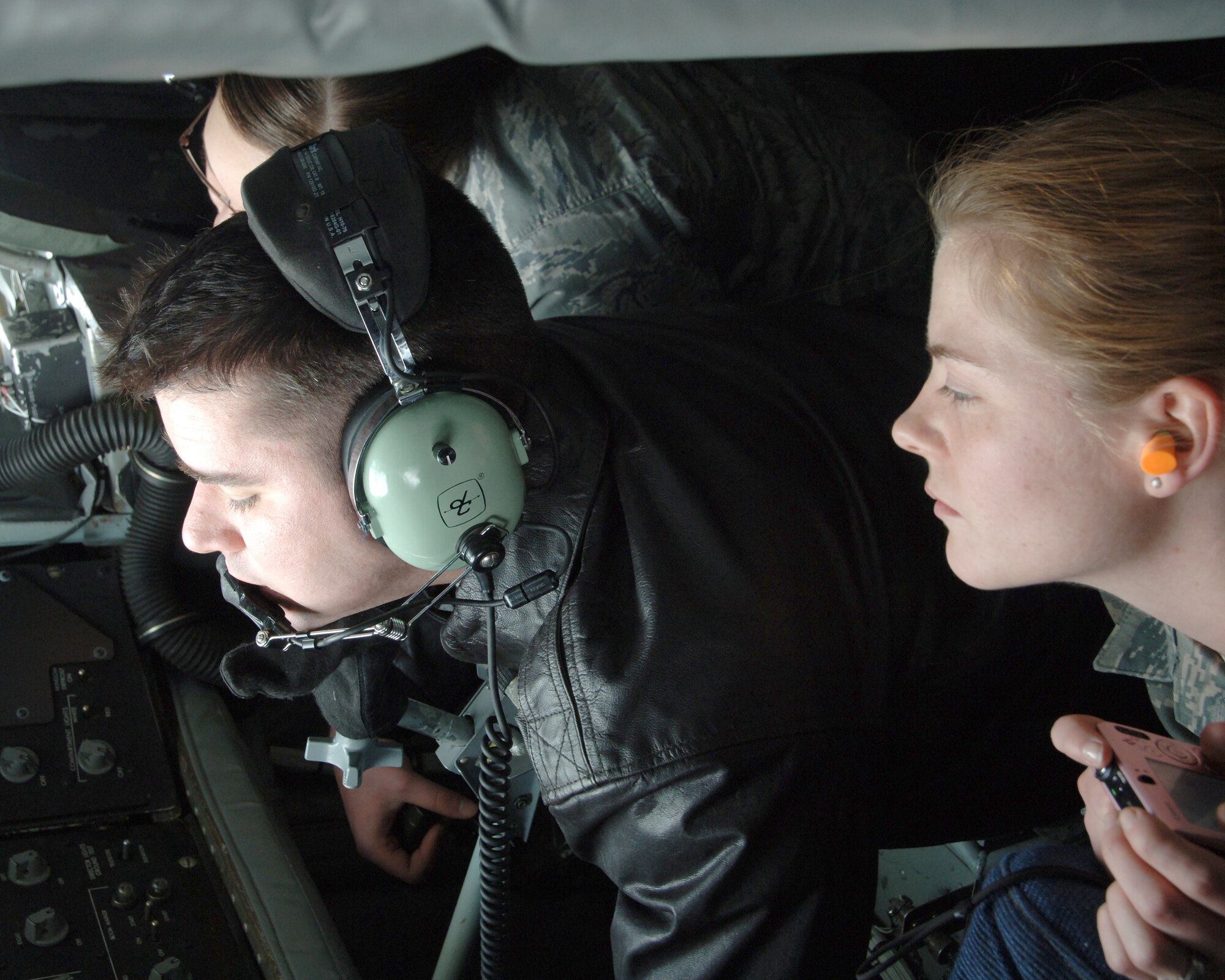 Airman 1st Class Kristin N. Bethany (right), 319th Operations Support Squadron, looks on while Staff Sgt. Stephen Swann, 905th Air Refueling Squadron, refuels a B-52 Stratofortress during an incentive flight Feb. 24. Incentive flights give Airmen an opportunity to see the 319th Air Refueling Wing’s primary mission first-hand. (U.S. Air Force photo by Senior Airman R. Michael Longoria)