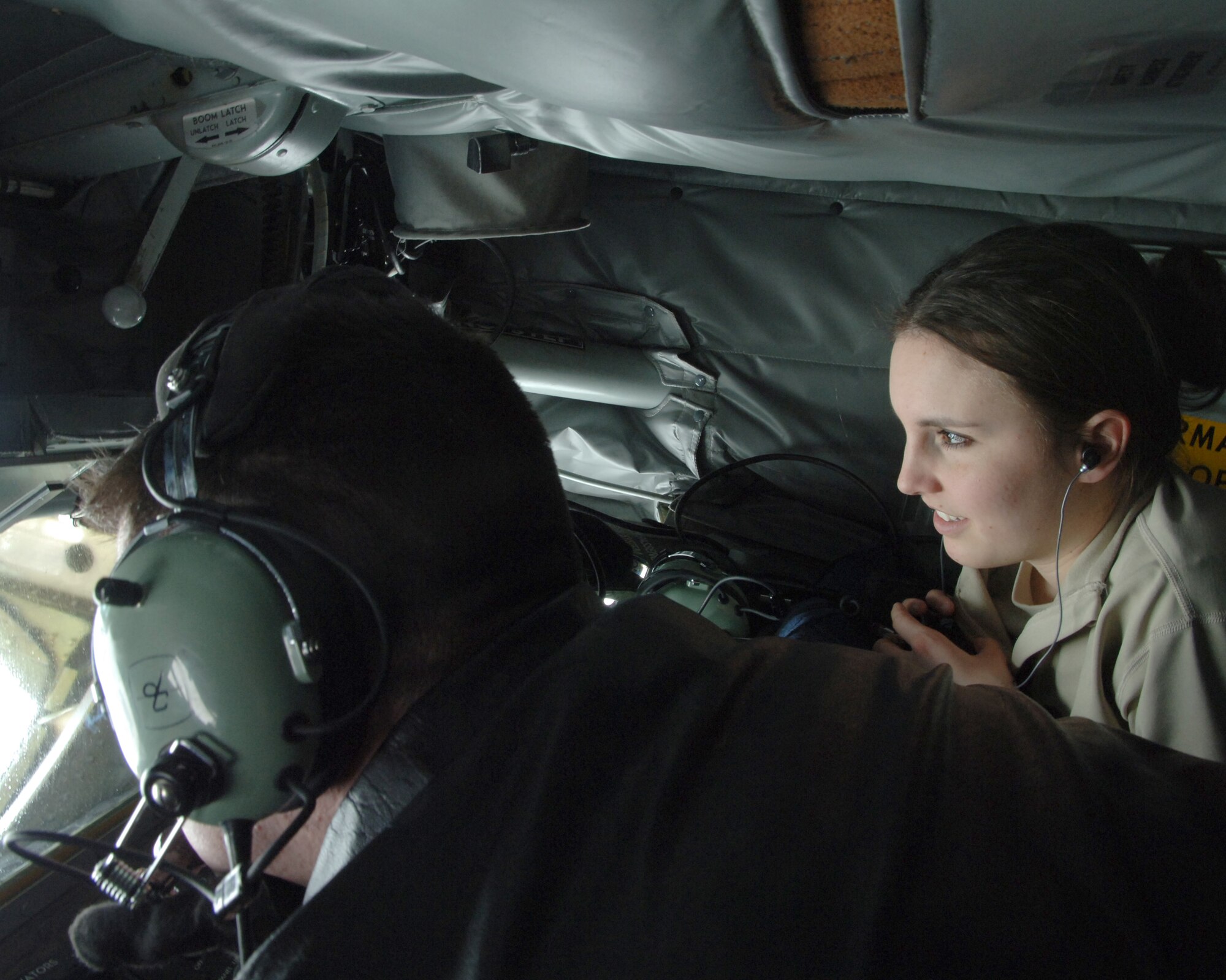 Airman 1st Class Jordan R. Anderson (right), 319th Force Support Squadron, looks on while Staff Sgt. Stephen Swann, 905th Air Refueling Squadron, refuels a B-52 Stratofortress during an incentive flight Feb. 24. Incentive flights give Airmen an opportunity to see the 319th Air Refueling Wing’s primary mission first-hand. (U.S. Air Force photo by Senior Airman R. Michael Longoria)