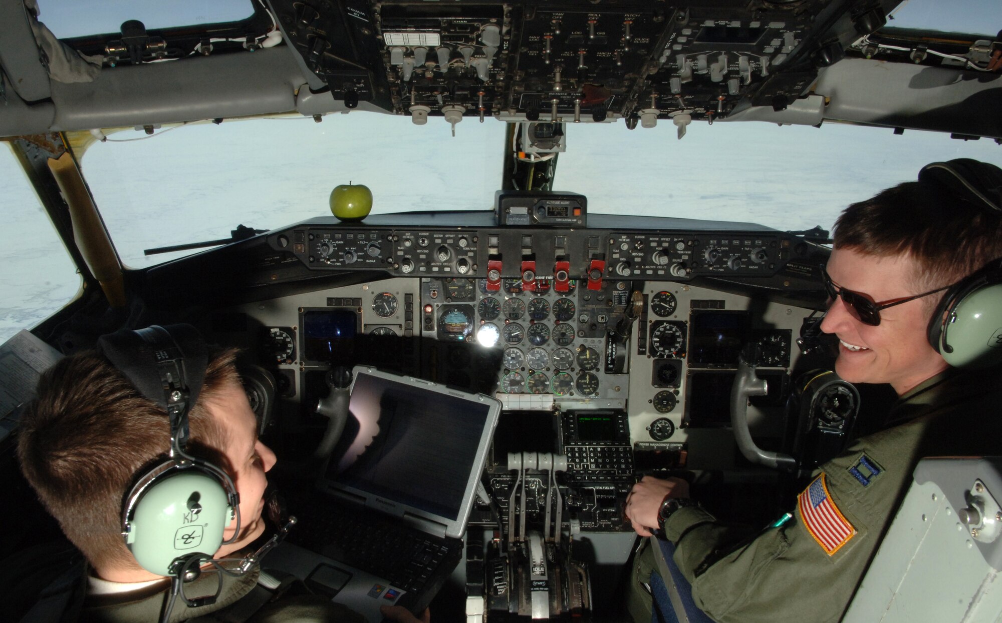 Capt. Kevin Dacy (left), 319th Operations Support Squadron, and Capt. Stephen Slaughter, 905th Air Refueling Squadron, talk while piloting a KC-135 Stratotanker during an incentive flight Feb. 24. Incentive flights give Airmen an opportunity to see the 319th Air Refueling Wing’s primary mission first-hand. During this particular flight, Airmen witnessed boom operators refuel a B-52 Stratofortress. (U.S. Air Force photo by Senior Airman R. Michael Longoria)